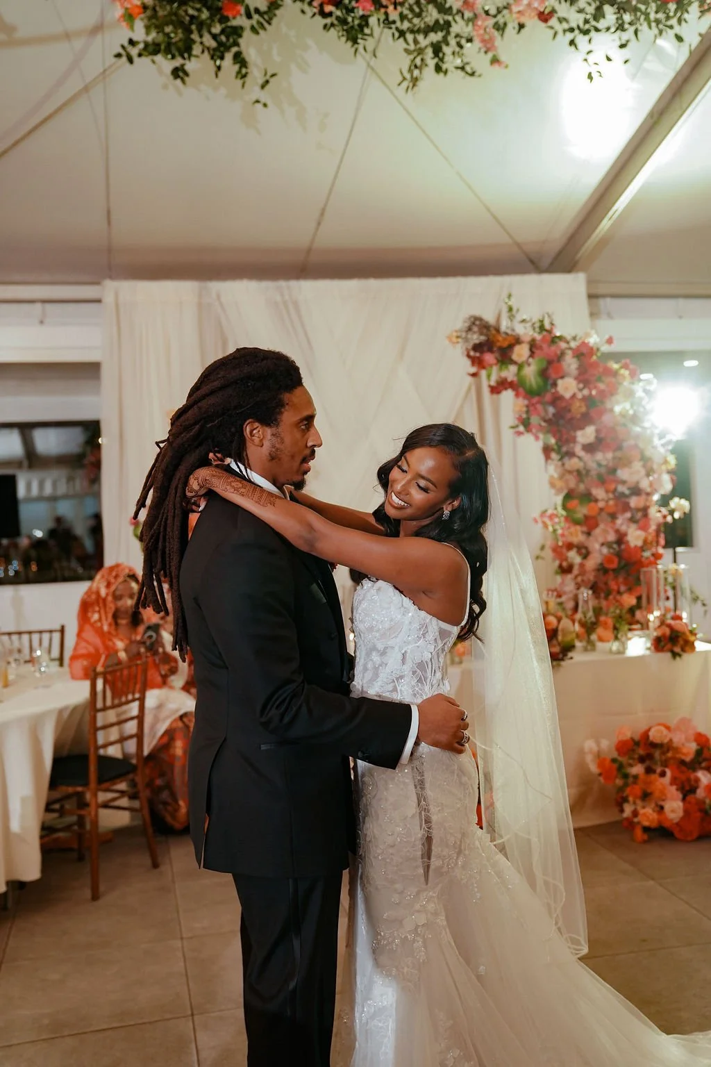Bold Skyline Events SF wedding with rich deep raspberry, olive green, orange, burgundy, and pink wedding flowers. Featuring striking bridal and bridesmaid bouquets, ceremony florals, colorful reception centerpieces, lush aisle arrangements, and premi