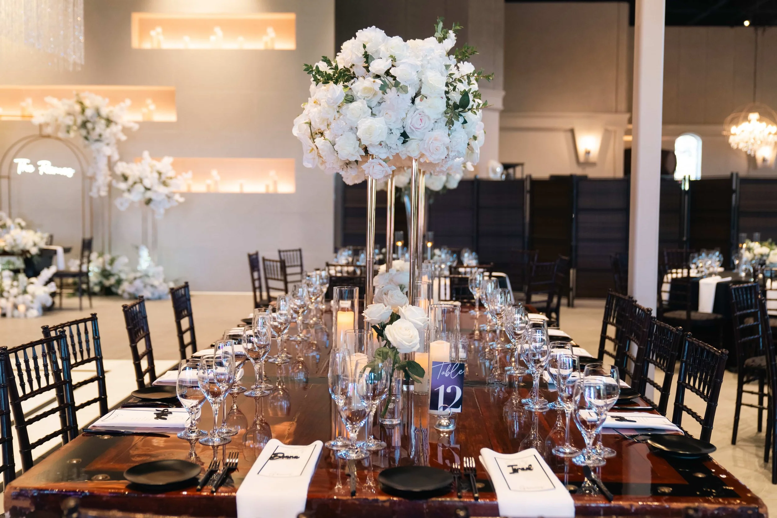 Lush white floral arrangements paired with glowing candles created a romantic, timeless setting for Erika & Javier’s wedding at Palm Event Center. Each bouquet and centerpiece was designed to reflect the couple’s classic style while enhancing the ven