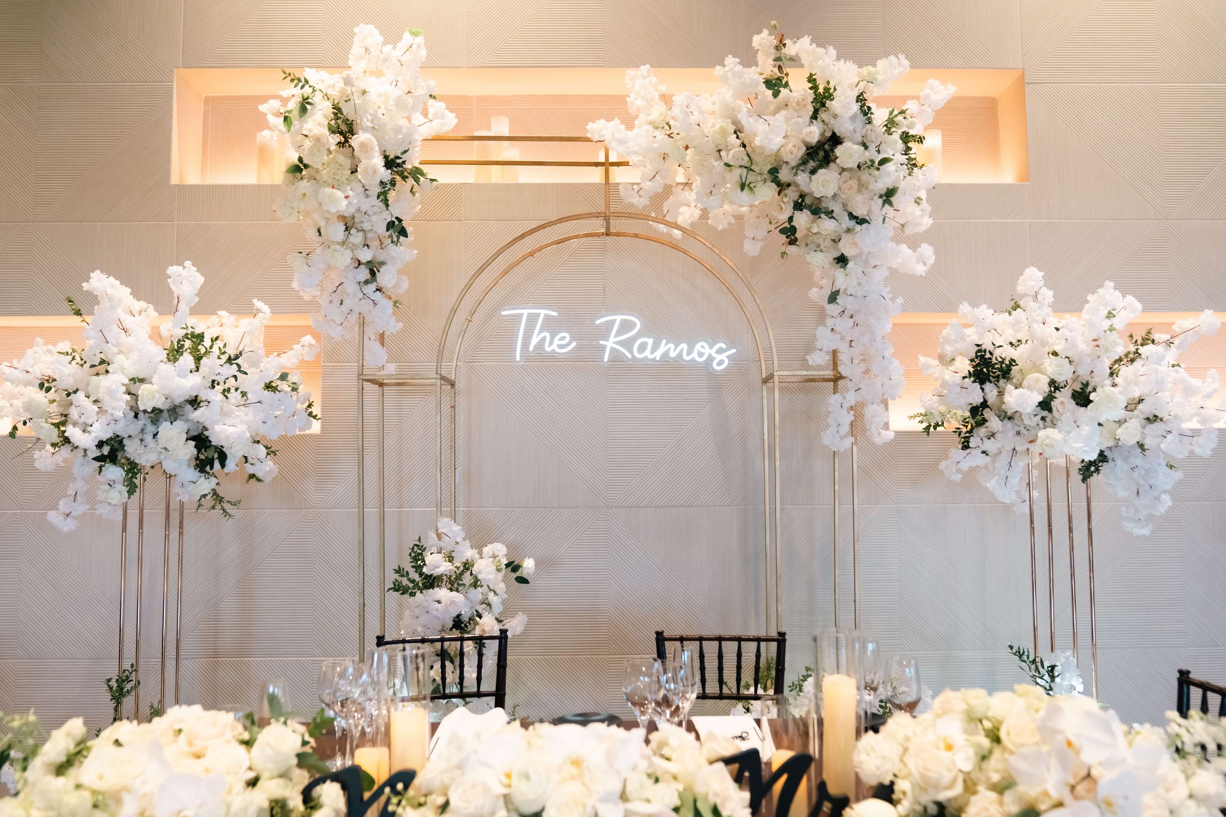 Lush white floral arrangements paired with glowing candles created a romantic, timeless setting for Erika & Javier’s wedding at Palm Event Center. Each bouquet and centerpiece was designed to reflect the couple’s classic style while enhancing the ven