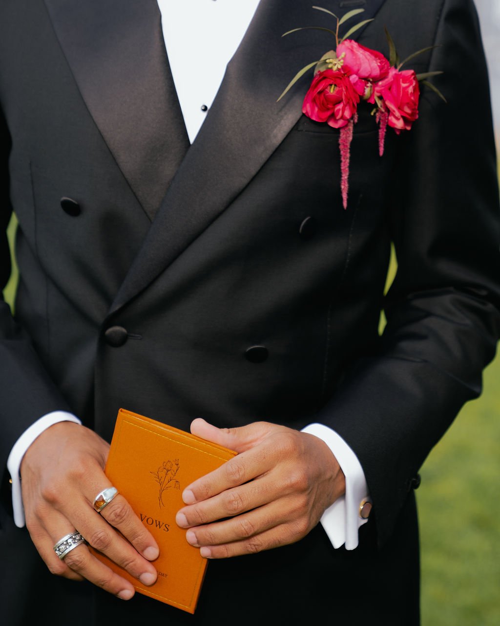 Bold Skyline Events SF wedding with rich deep raspberry, olive green, orange, burgundy, and pink wedding flowers. Featuring striking bridal and bridesmaid bouquets, ceremony florals, colorful reception centerpieces, lush aisle arrangements, and premi