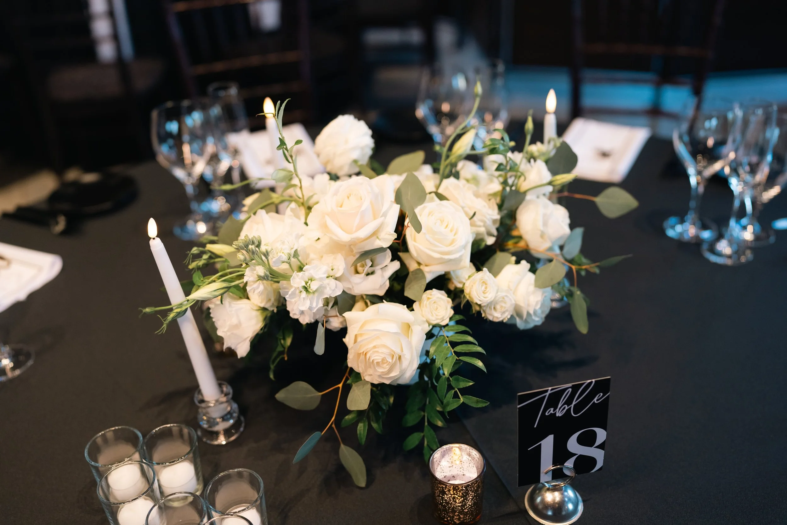 Lush white floral arrangements paired with glowing candles created a romantic, timeless setting for Erika & Javier’s wedding at Palm Event Center. Each bouquet and centerpiece was designed to reflect the couple’s classic style while enhancing the ven