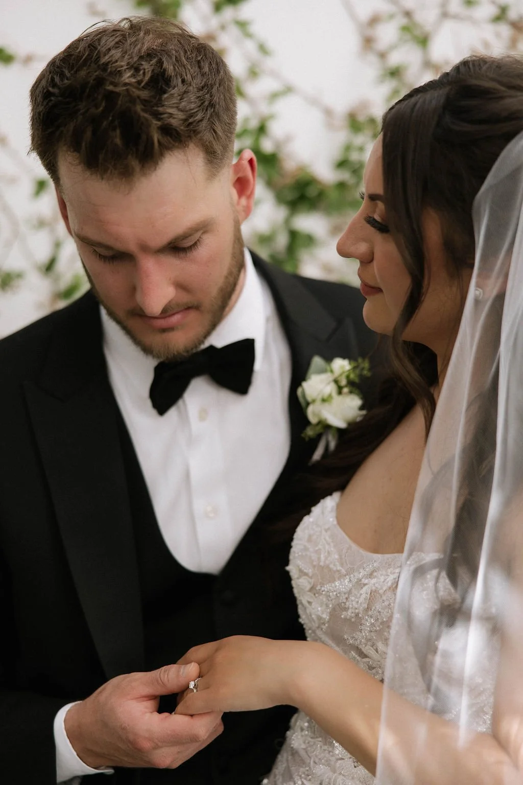 An elegant all-white palette transformed Blanco Urban Venue into a chic urban oasis for Bianca & John’s wedding. Lush roses, towering delphiniums, and touches of soft greenery lined the aisle, creating a bright, modern pathway toward the fireplace al