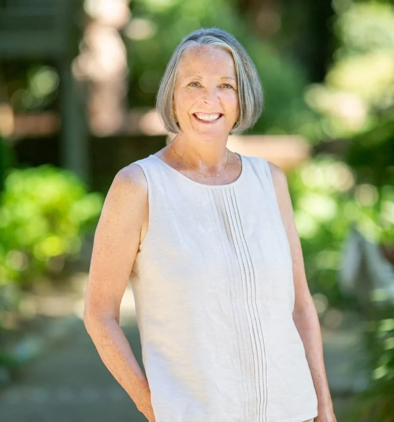 The owner of an events company, one of our valued partners of The Flowers Valley, radiating warmth and expertise in a serene outdoor setting.