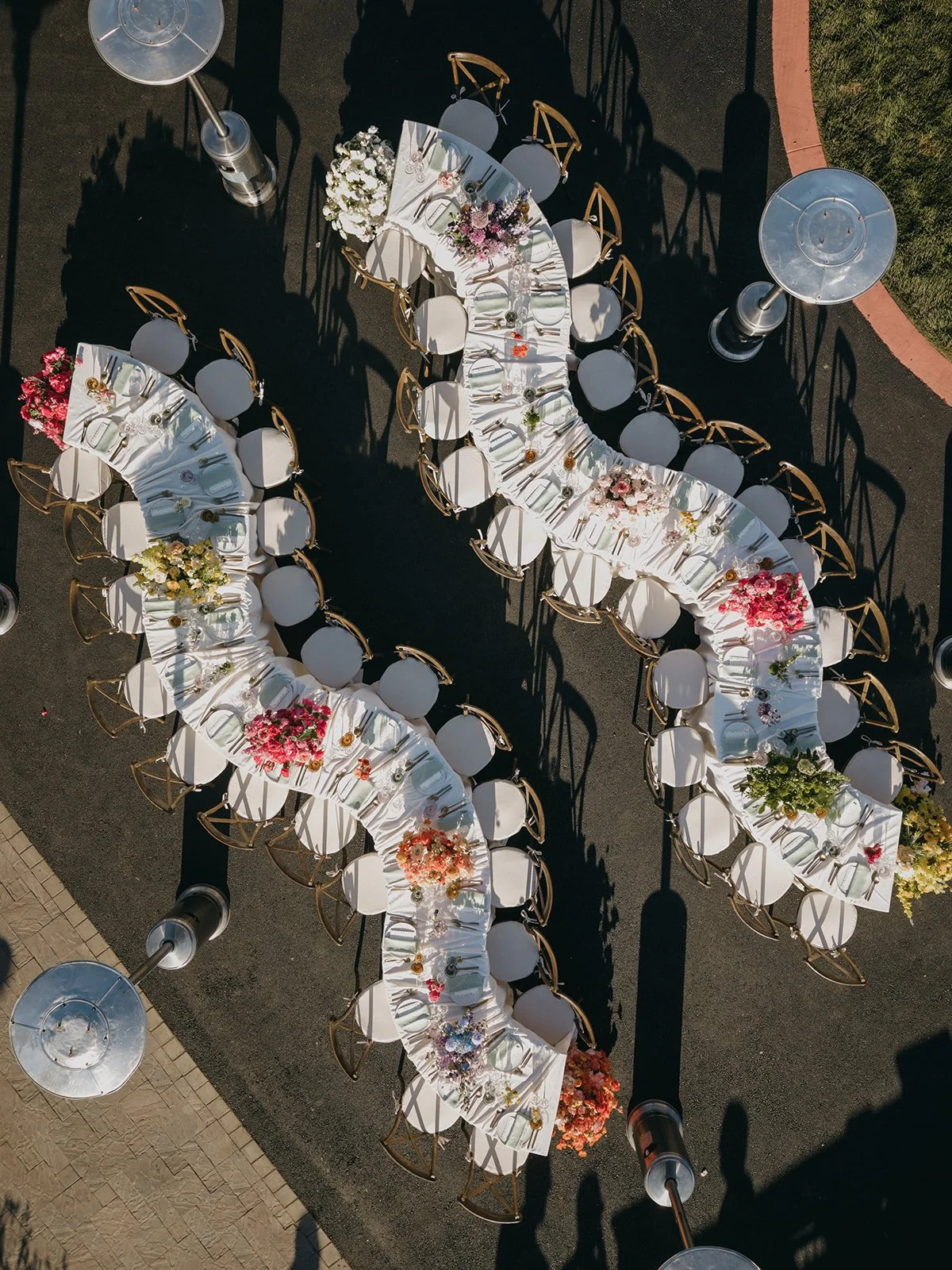 This private residence wedding featured vibrant color-blocking wedding flowers, with each floral arrangement designed in a single bold hue to create a cohesive yet playful aesthetic. From the ceremony to the reception, the custom floral designs trans