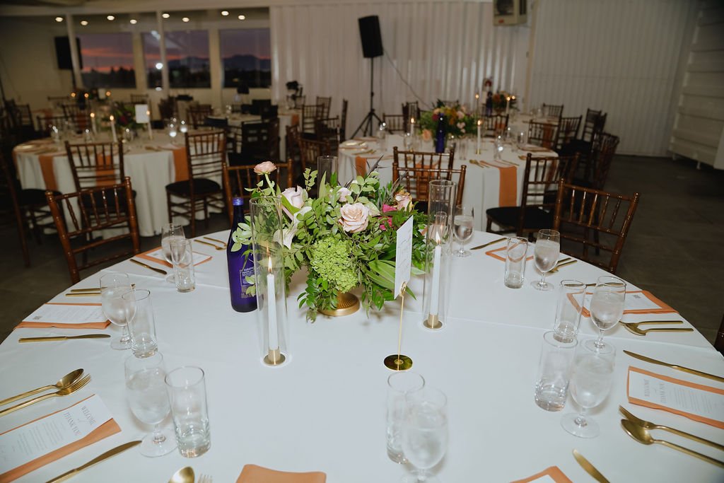 Bold Skyline Events SF wedding with rich deep raspberry, olive green, orange, burgundy, and pink wedding flowers. Featuring striking bridal and bridesmaid bouquets, ceremony florals, colorful reception centerpieces, lush aisle arrangements, and premi