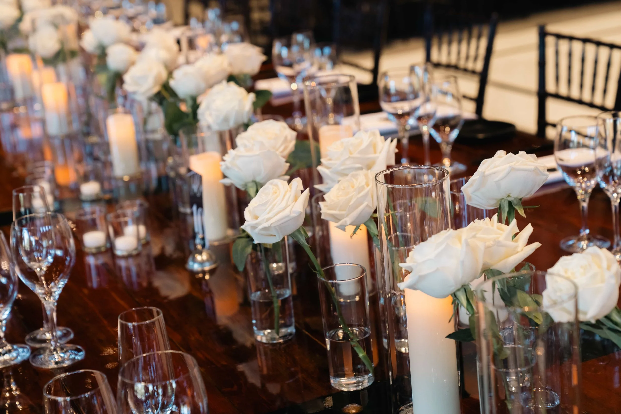 Lush white floral arrangements paired with glowing candles created a romantic, timeless setting for Erika & Javier’s wedding at Palm Event Center. Each bouquet and centerpiece was designed to reflect the couple’s classic style while enhancing the ven
