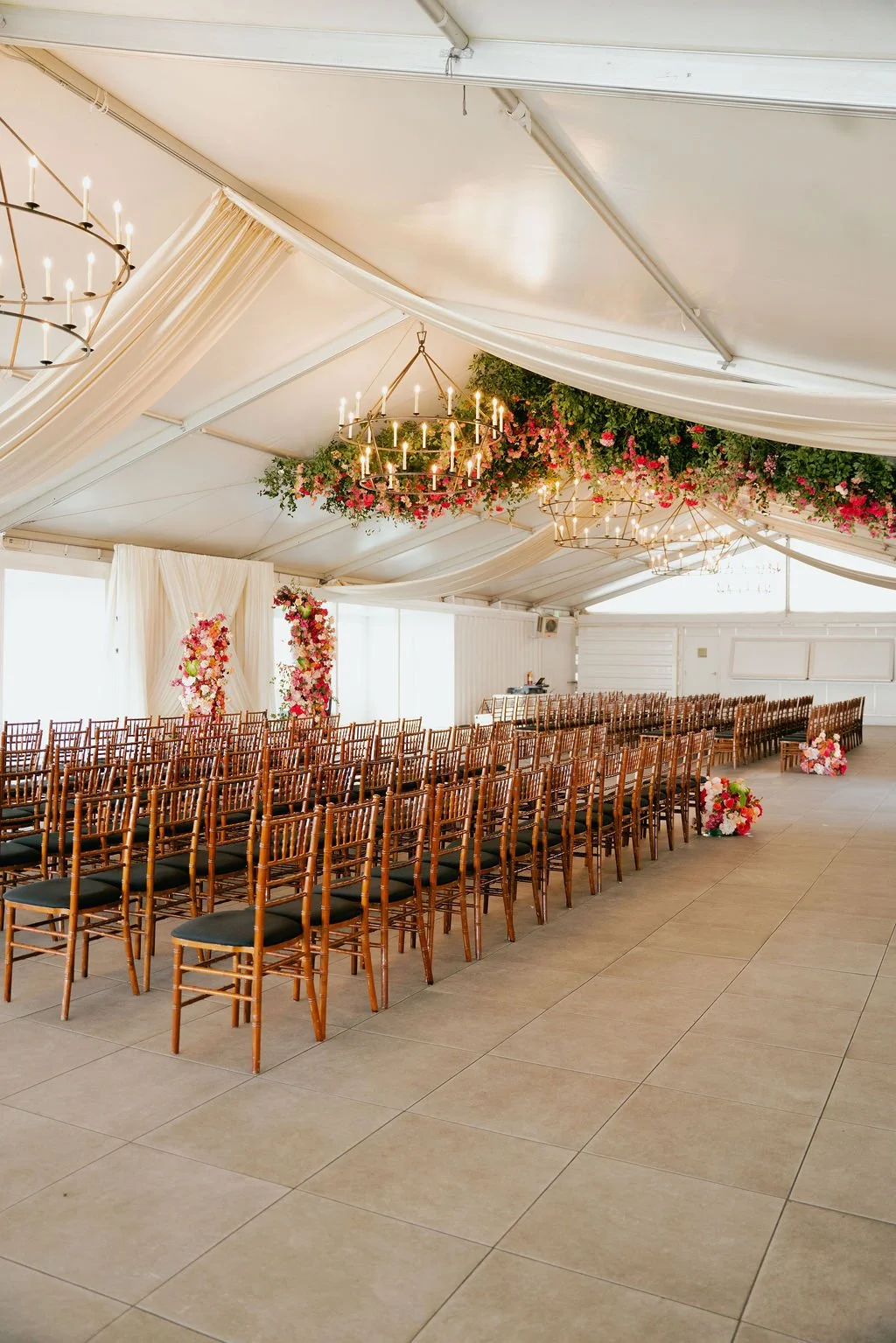 Bold Skyline Events SF wedding with rich deep raspberry, olive green, orange, burgundy, and pink wedding flowers. Featuring striking bridal and bridesmaid bouquets, ceremony florals, colorful reception centerpieces, lush aisle arrangements, and premi