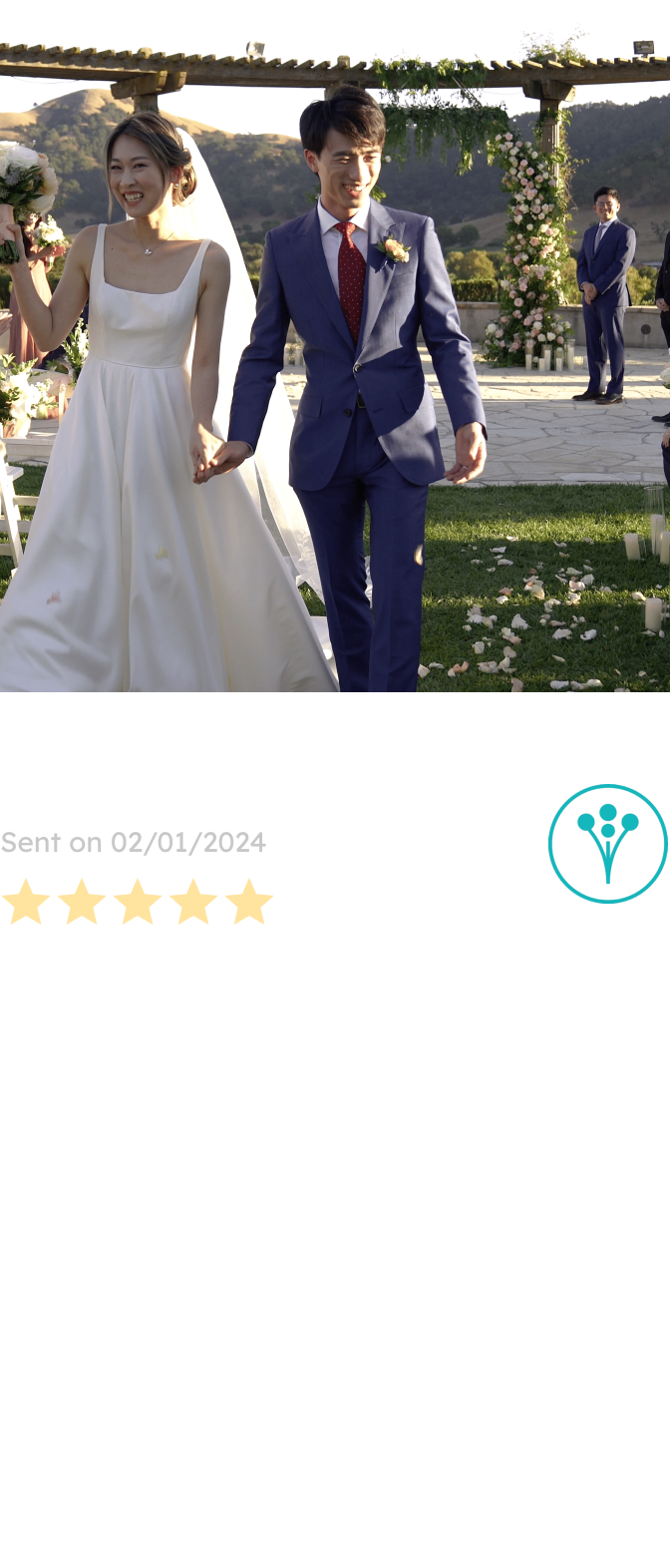 A joyful couple, the bride in a classic white gown and the groom in a navy suit, walks hand-in-hand down the aisle adorned with elegant floral decorations, designed by a San Francisco-based florist.