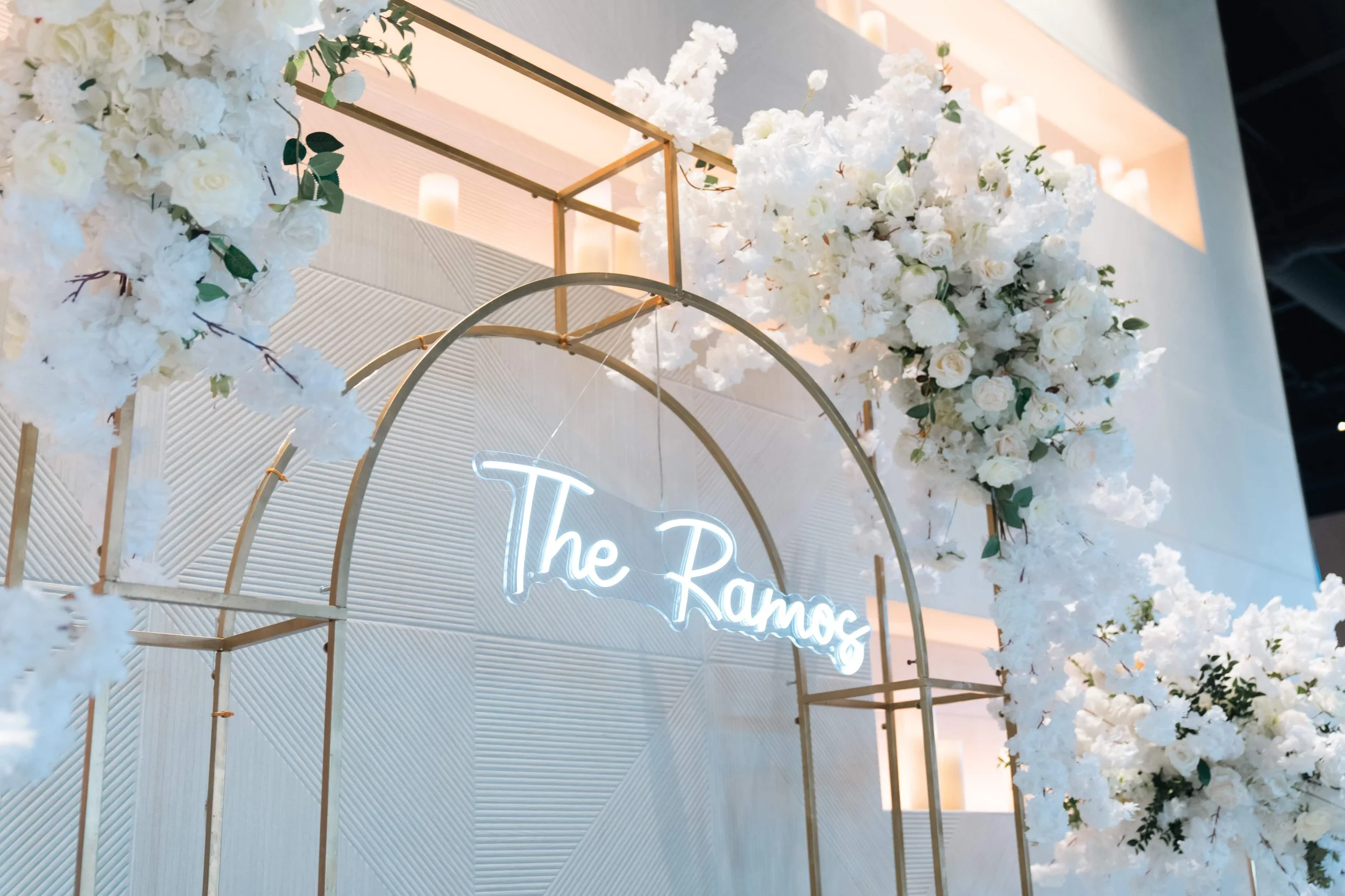 Lush white floral arrangements paired with glowing candles created a romantic, timeless setting for Erika & Javier’s wedding at Palm Event Center. Each bouquet and centerpiece was designed to reflect the couple’s classic style while enhancing the ven