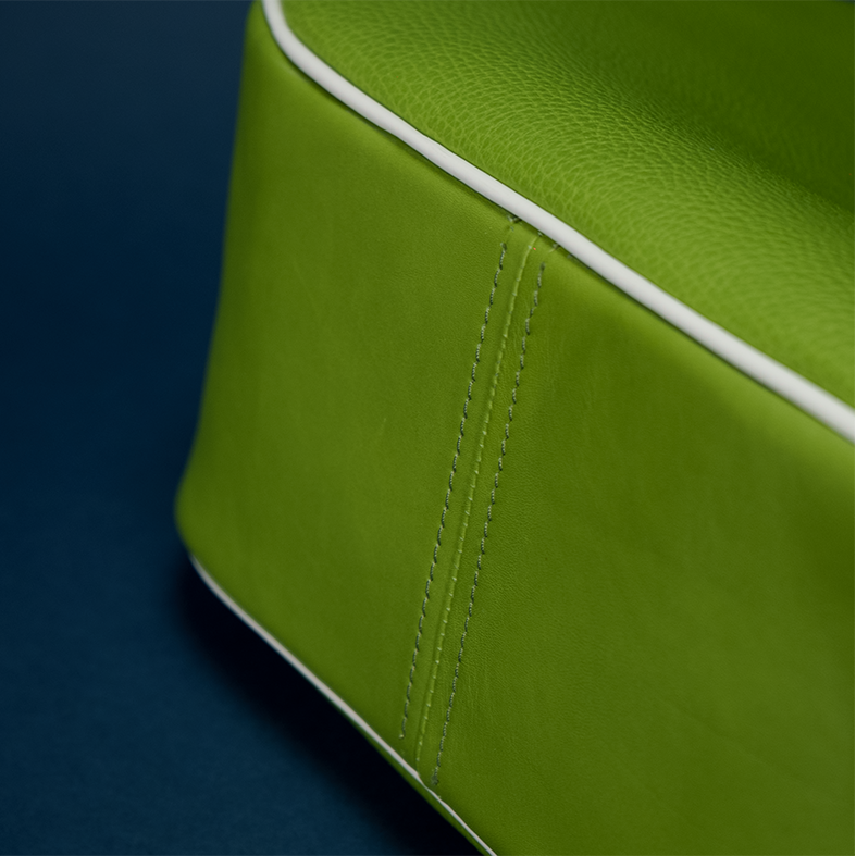 REINA Shoulder Bag in Mexi — green suede crescent silhouette with red and white Italian leather Duo detailing and gunmetal hardware, paired with the RINA La Chingona sneaker