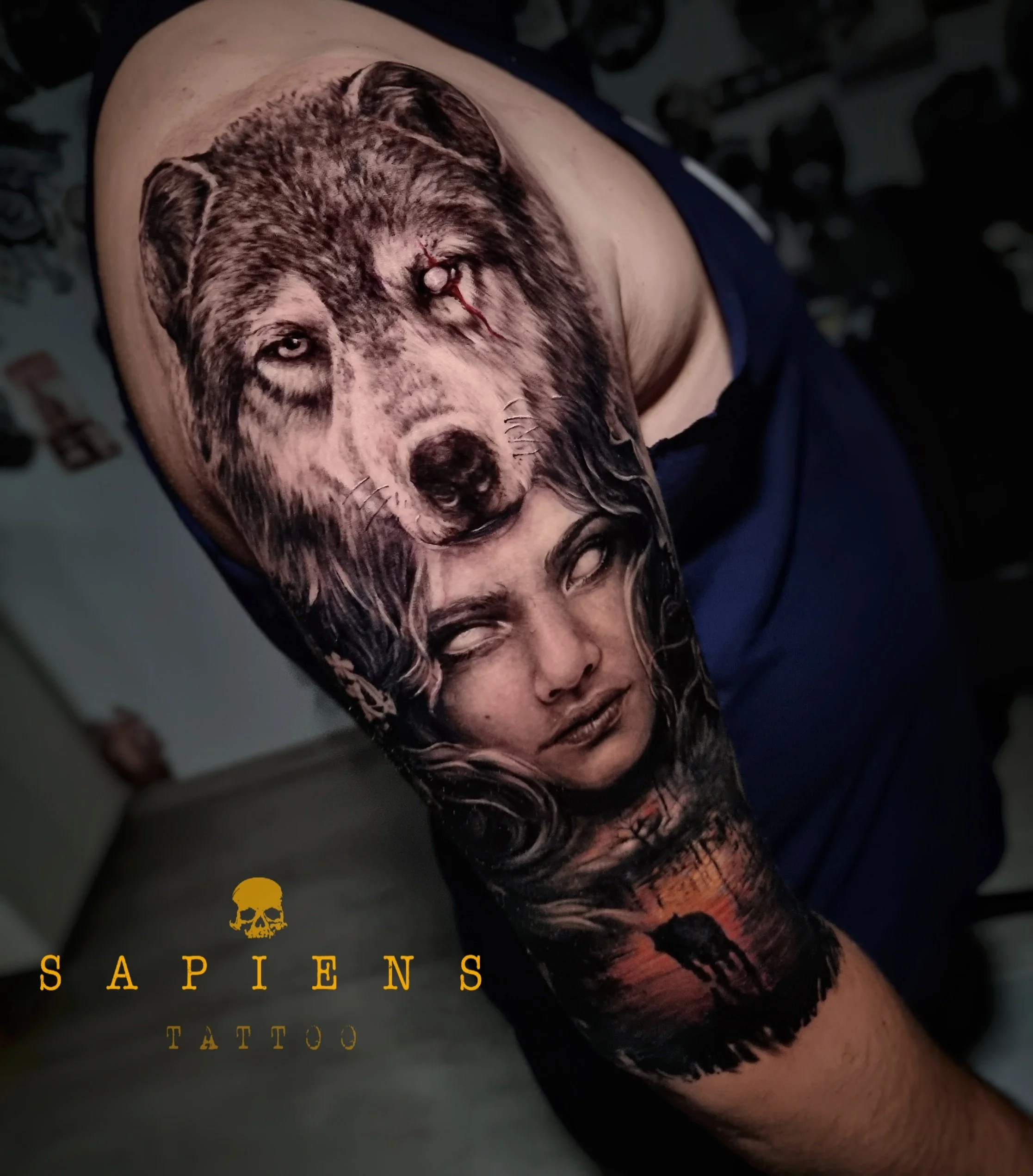 half full sleeve tattoo with wolf and woman starting on shoulder