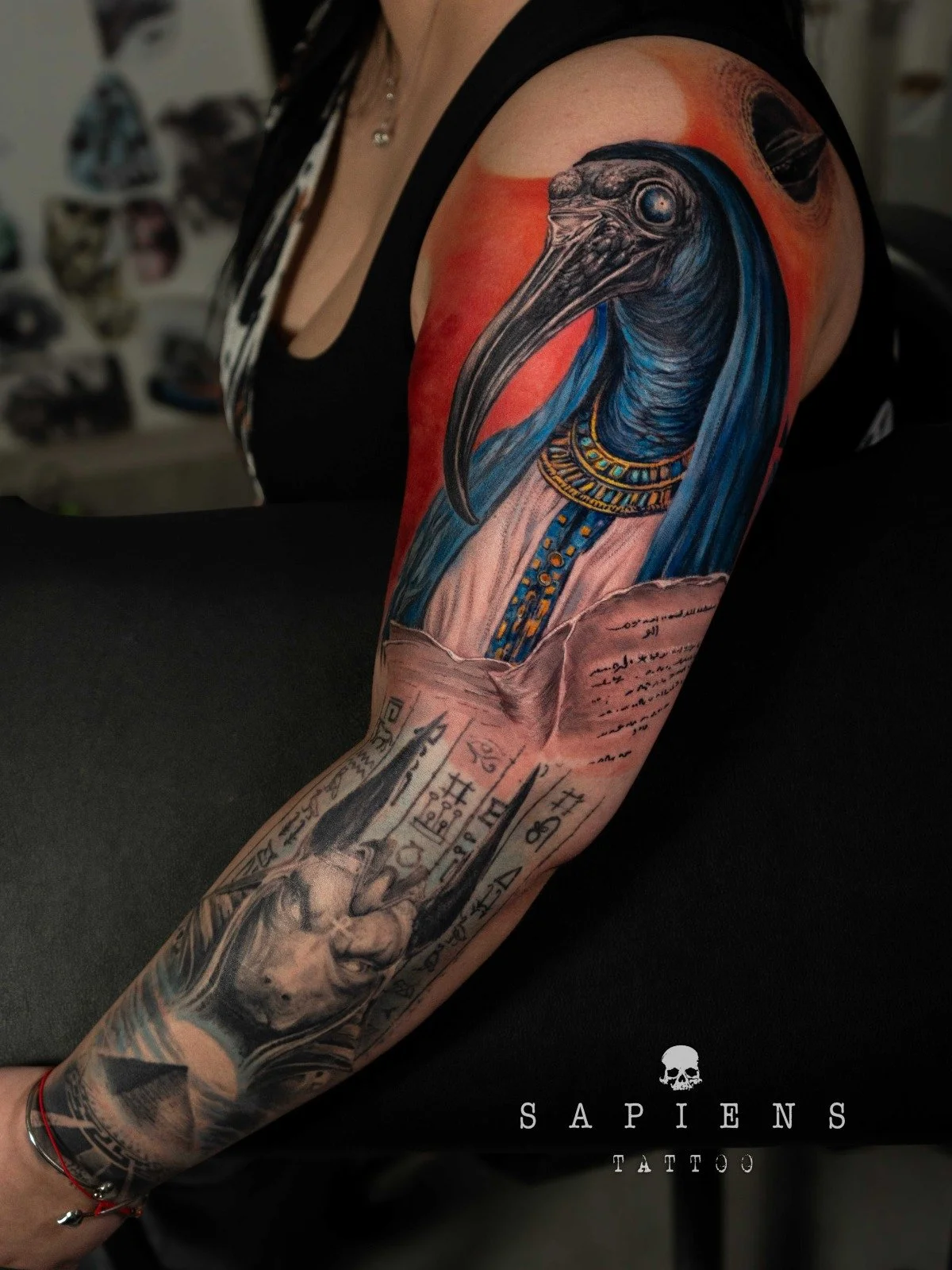 tatuaj color sleeve cu tema egipteana si zeul ra pentru o femeie