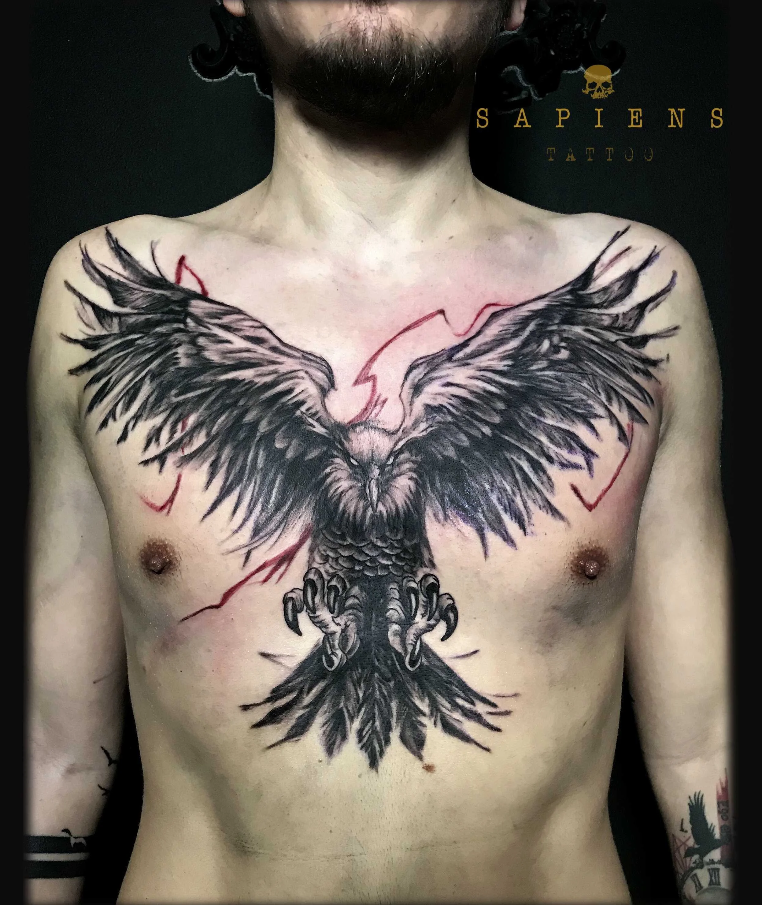 eagle tattoo on the chest with red ink