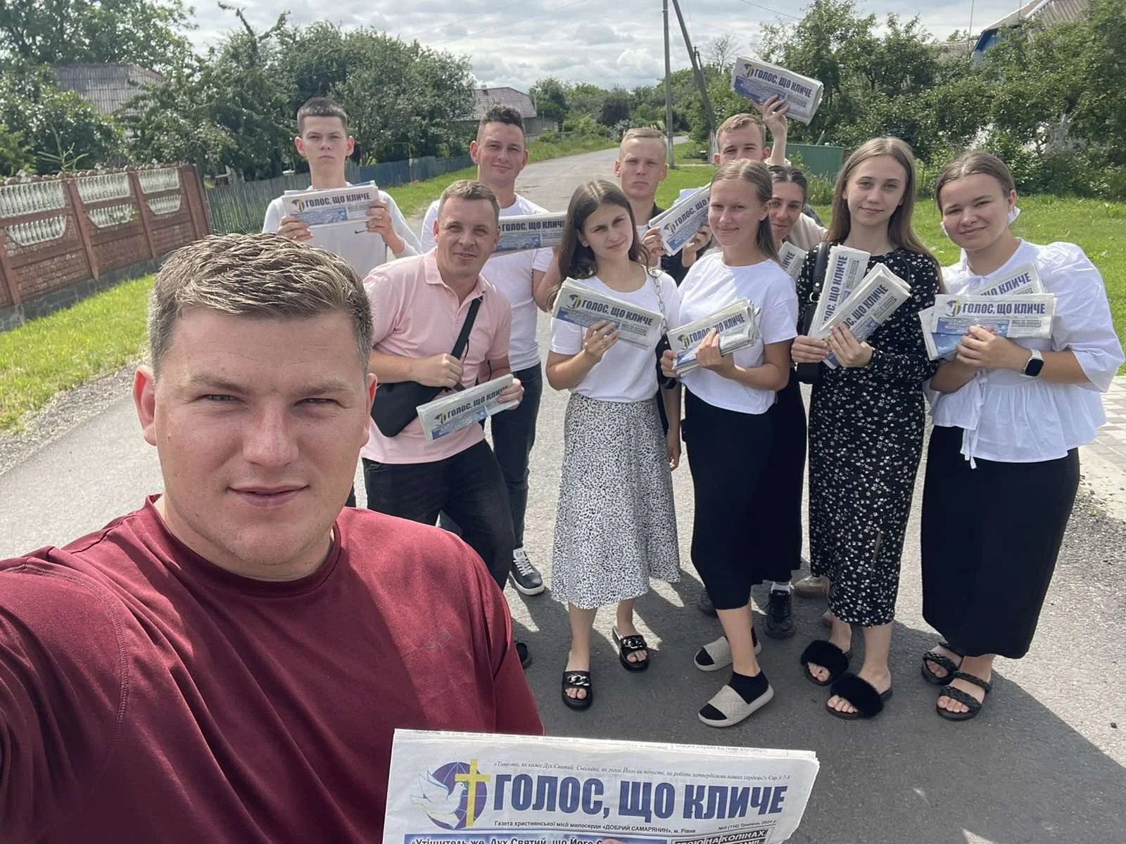 group of missionaries handing out newspapers