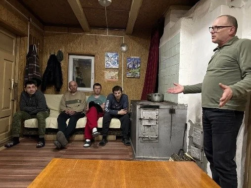A group of men in a rehab home.