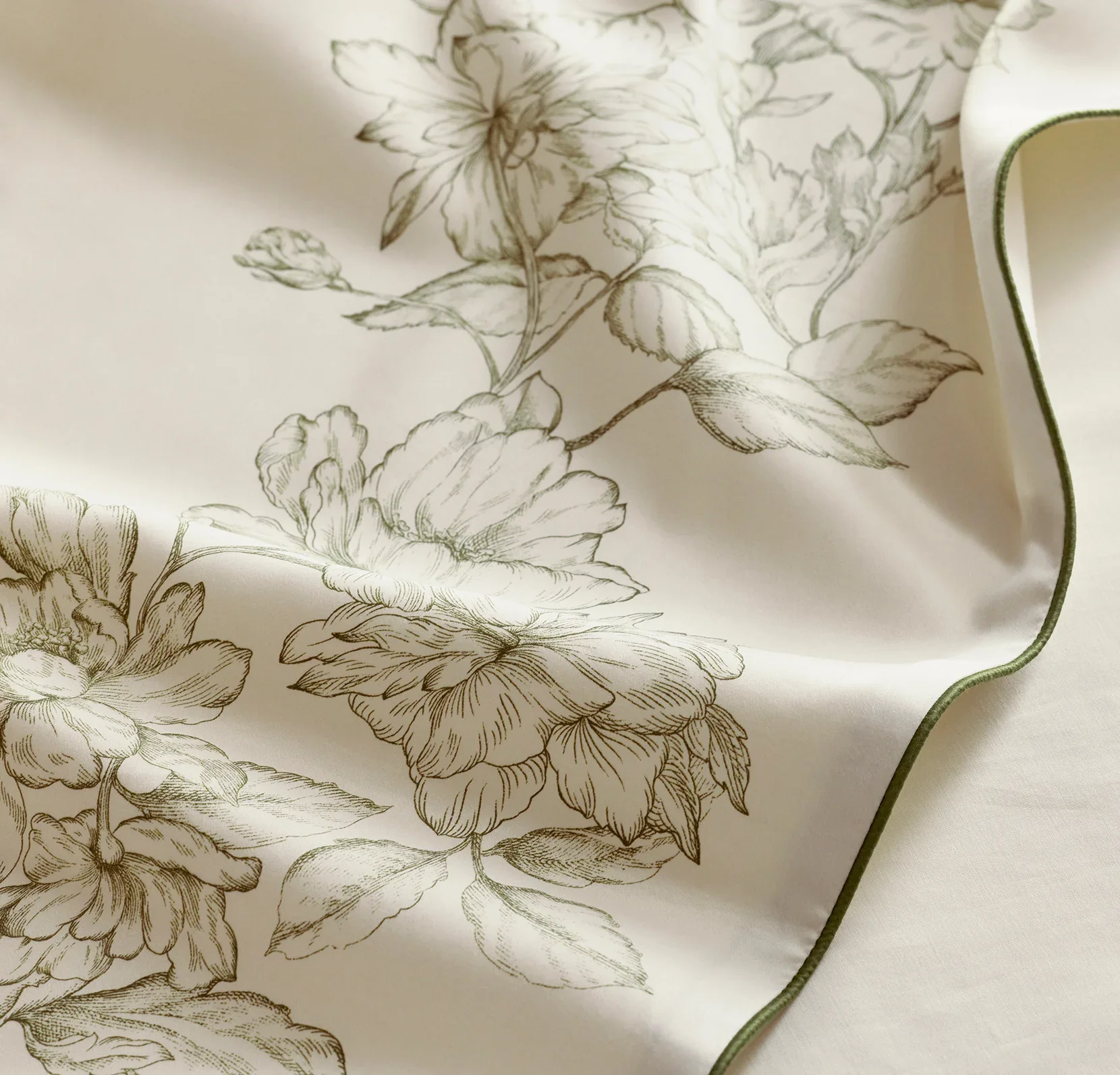 Etched_Peony_CreamOlivine_Signature_PipedEdge_DuvetSet_Detail_ADAMS_06062025_V1_FINAL.webp