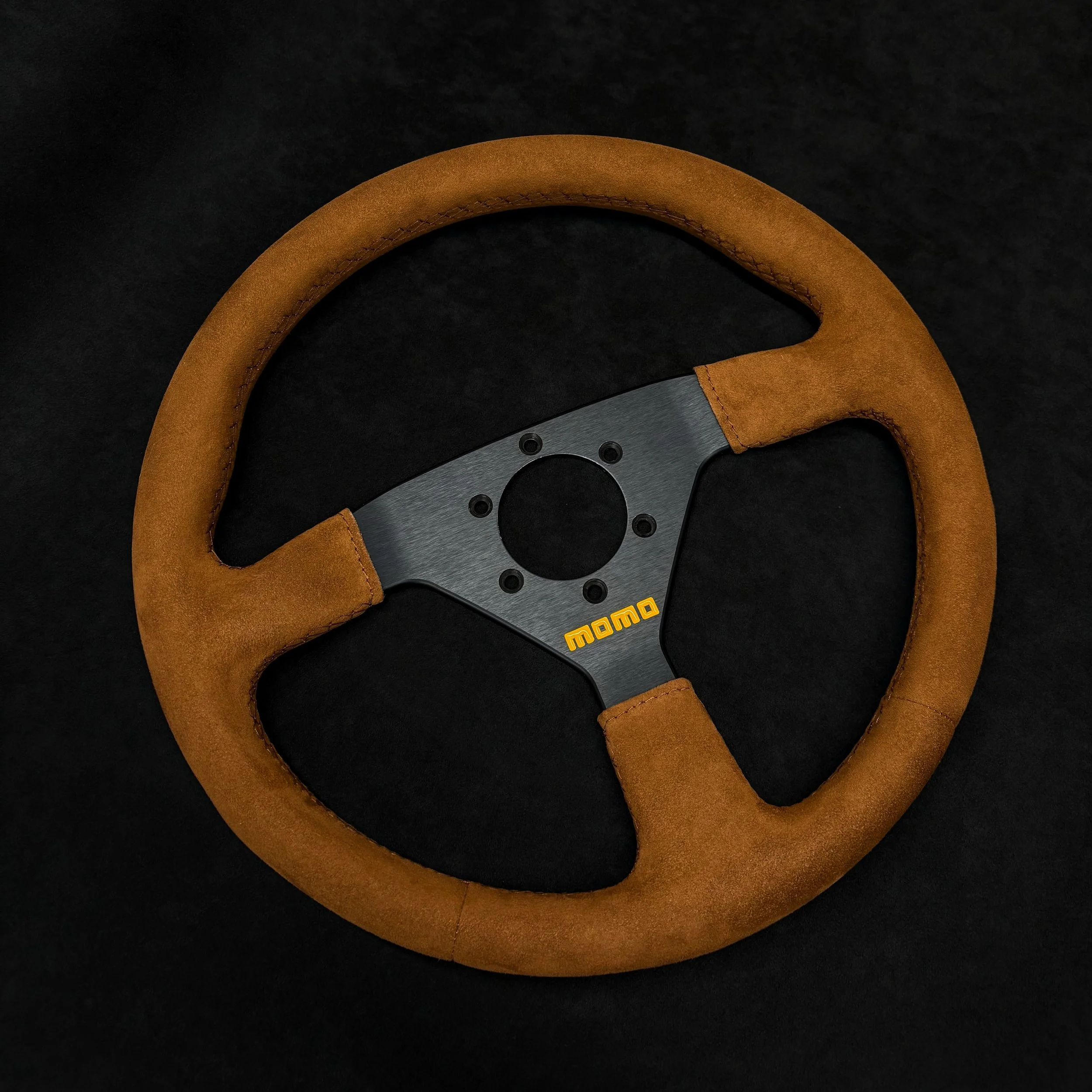 Momo steering wheel - retrimmed in Brown Alcantara with colour matched thread. 🪡