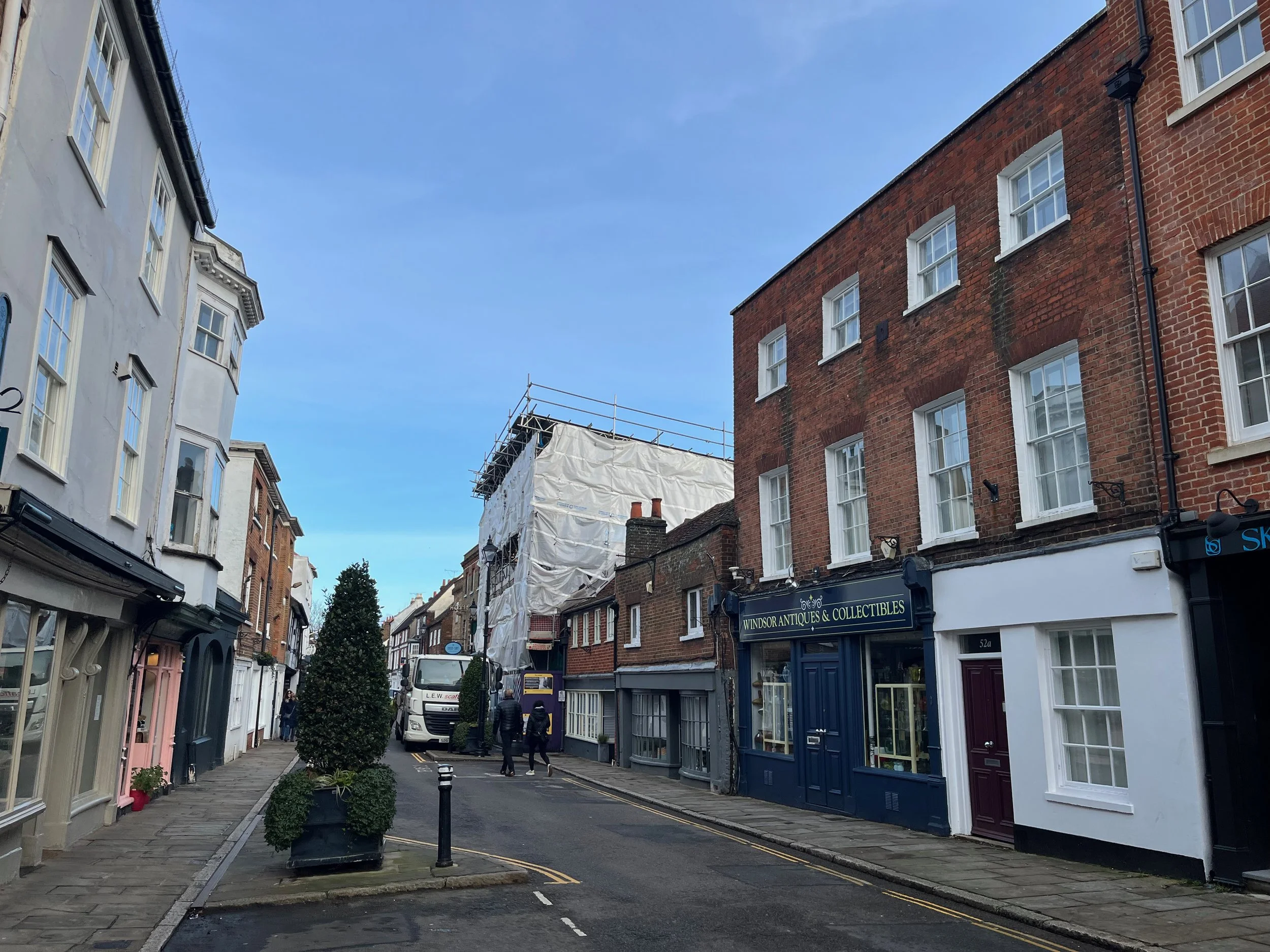 Medieval timber frame houses on Eton High Street, covered in scaffold, undergoing conservation repair.