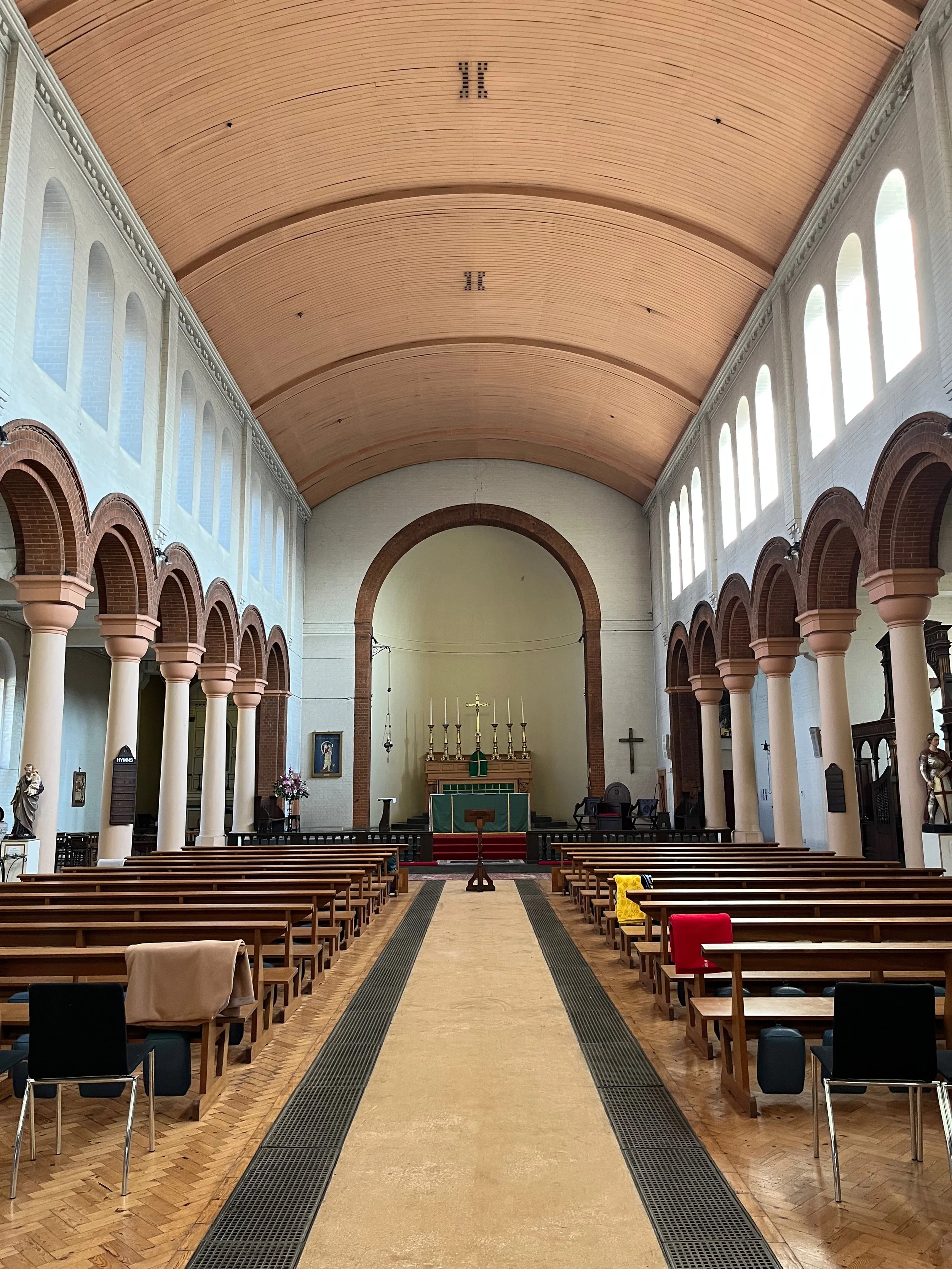 Inside of St Peter's Church, Acton Green, a yellow and red brick church where Sarah undertakes the QI inspection and is leading projects for repair, reordering, improving access and creating space.