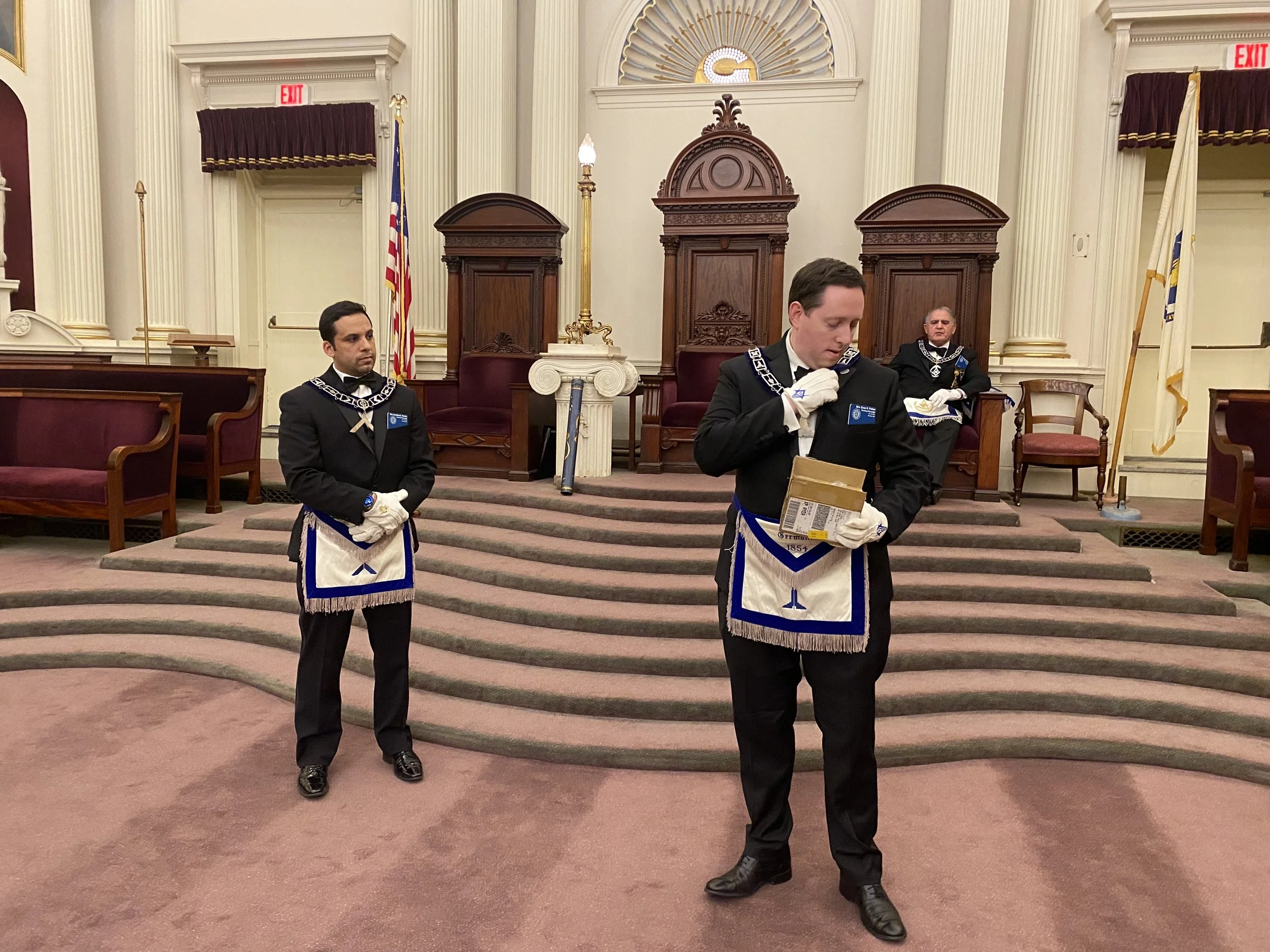  Bro. Evan Fisher showcasing the new lapel pin with the seal of The Henry Price Lodge 