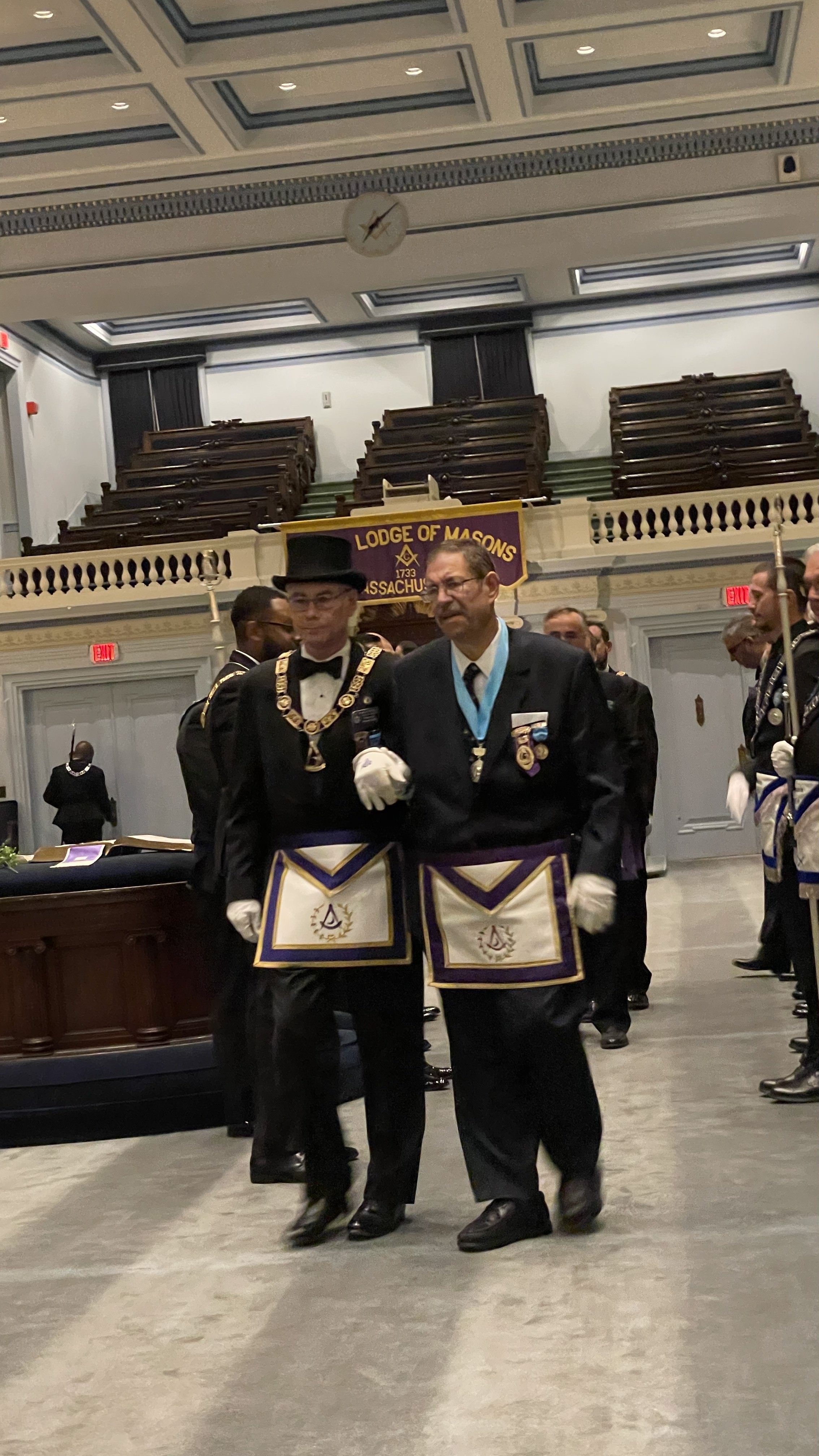 R.W. Brother Connelly being escorted by the Chairman of the Committee, R.W. Gary Miller 