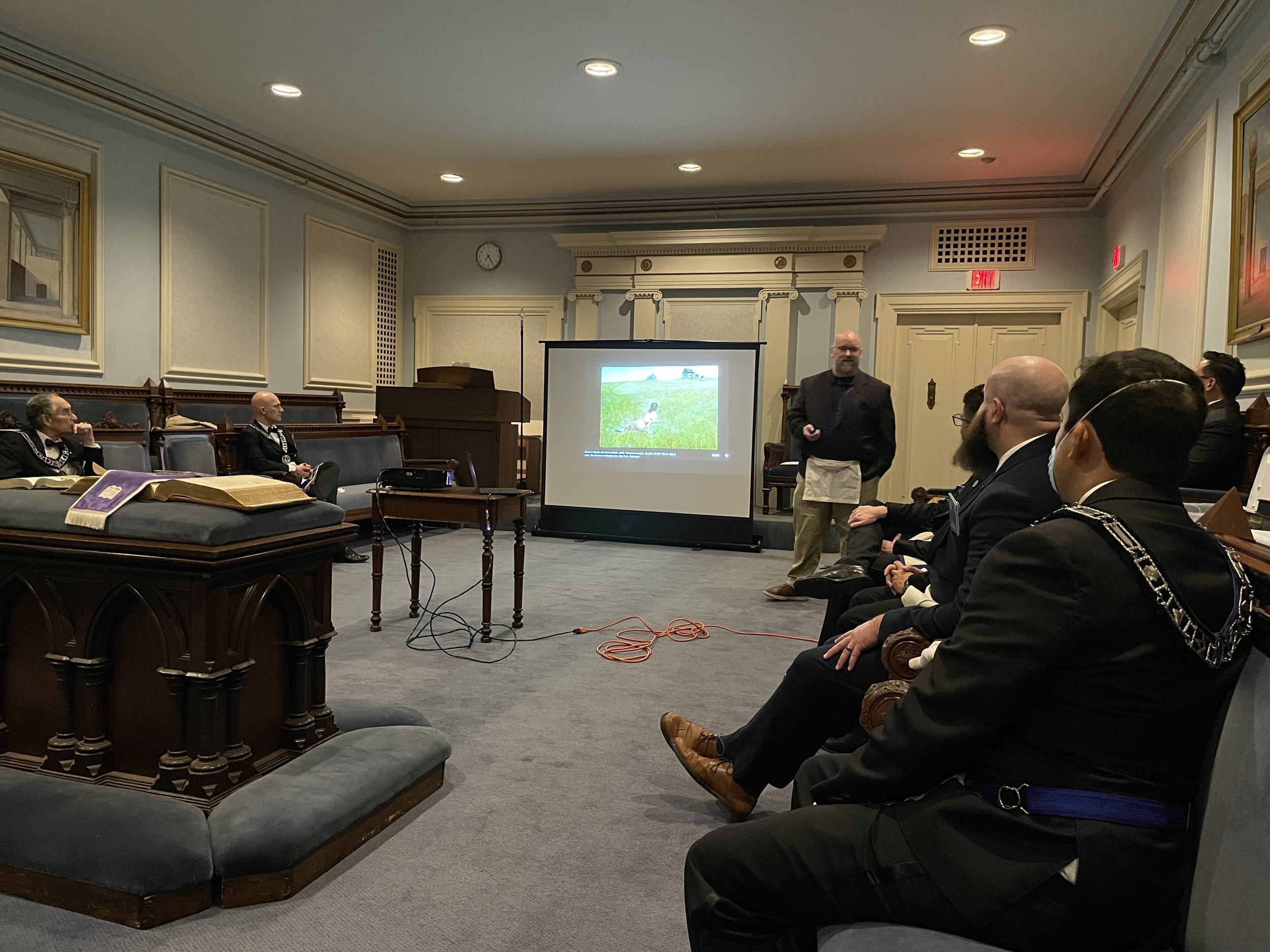  Wor. Ryan Flynn giving his talk on Freemasonry and the Fine Arts in Doric Hall. 