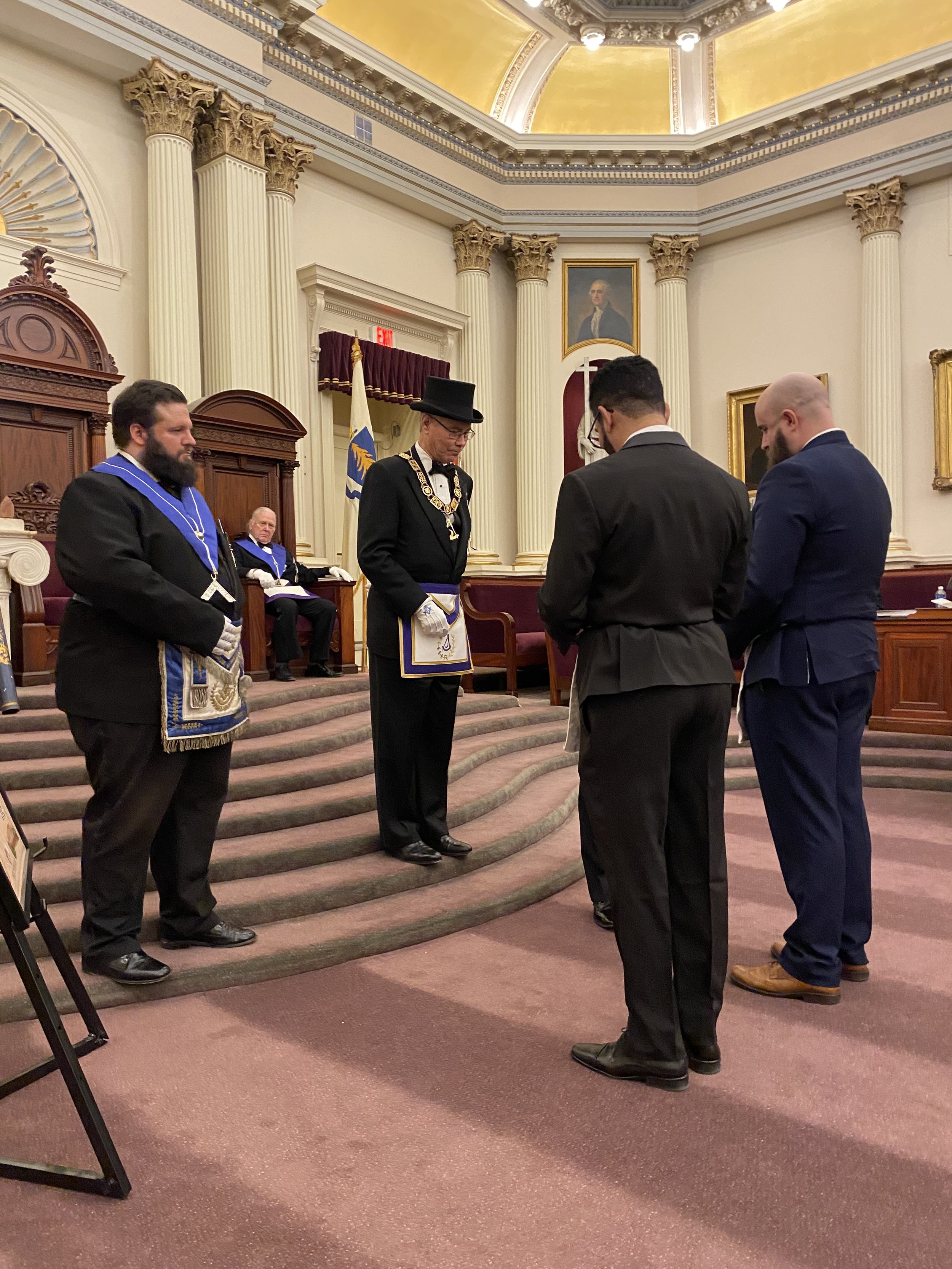  The newest Master Masons receiving the post-degree parting gifts, including the Claudy 3rd degree book, their Masonic Passport, and the 3rd Degree cipher 