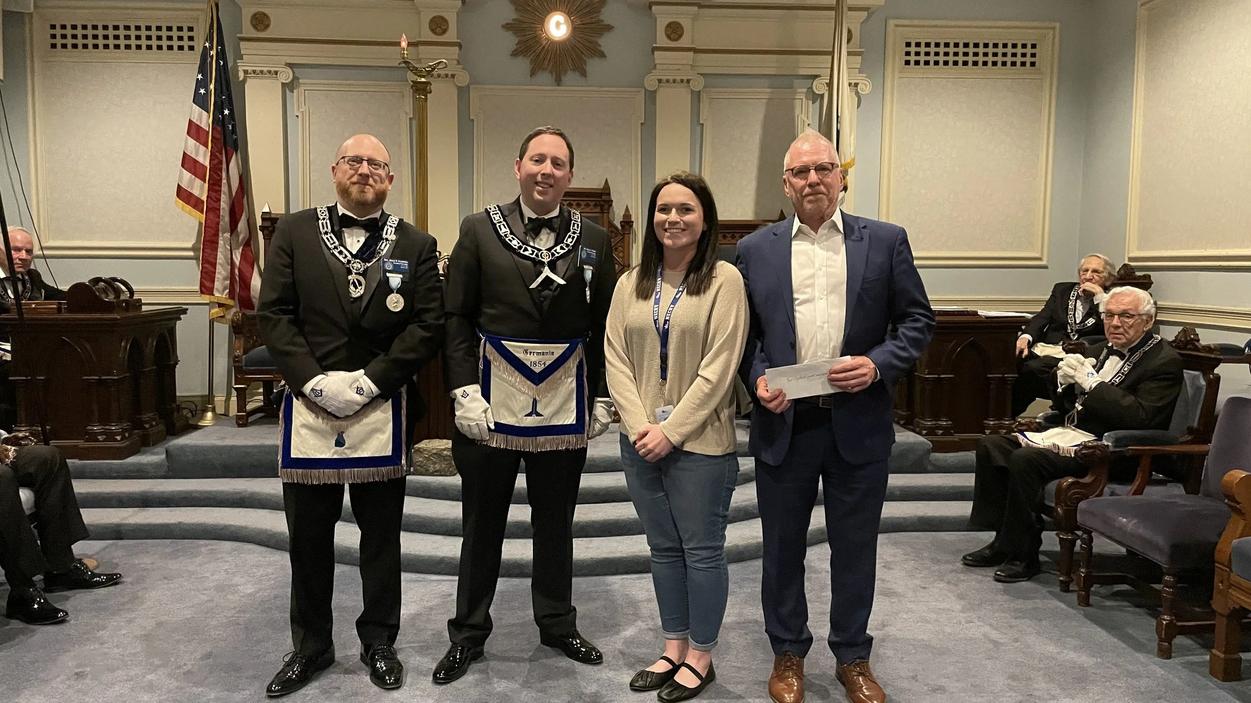  Acting Master, Bro. Evan S. Fisher, and Bro. Jason H. Cummins welcome Ms. Savannah Cooper and Mr. Kevin Ward from The New England and Center and Home for Veterans 
