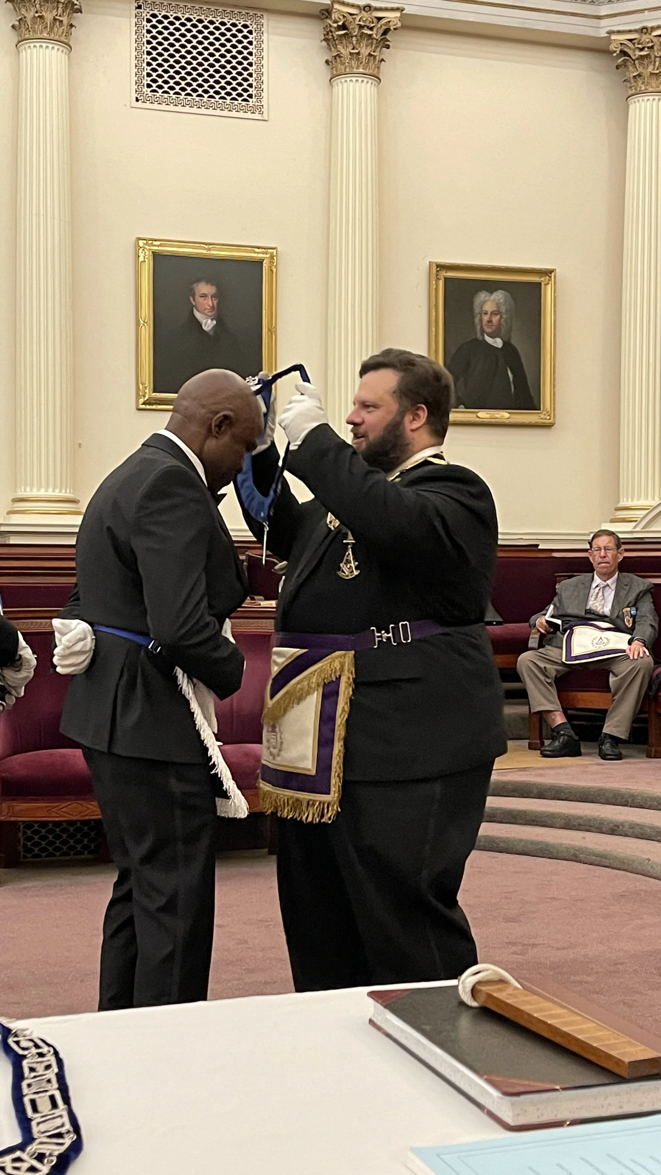  Bro. Jacques D. Jean invested with the Jewel of the Junior Warden, the Plumb 