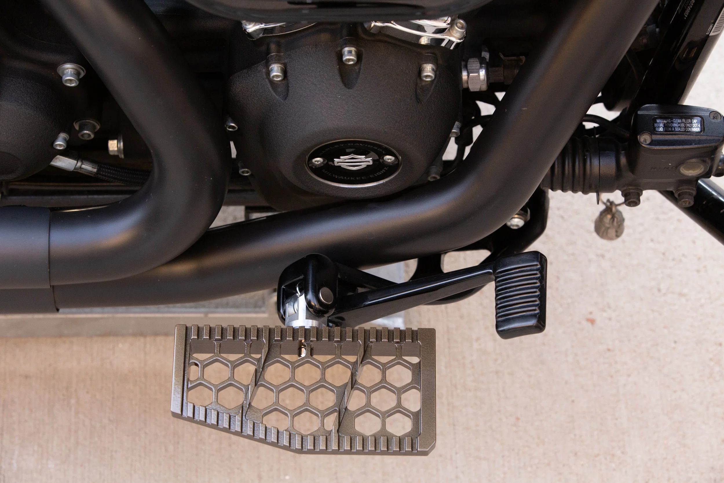 Vengeance Customs rider floorboards for 2018+ Harley-Davidson Softail in Bronze Bound Finish, installed on motorcycle