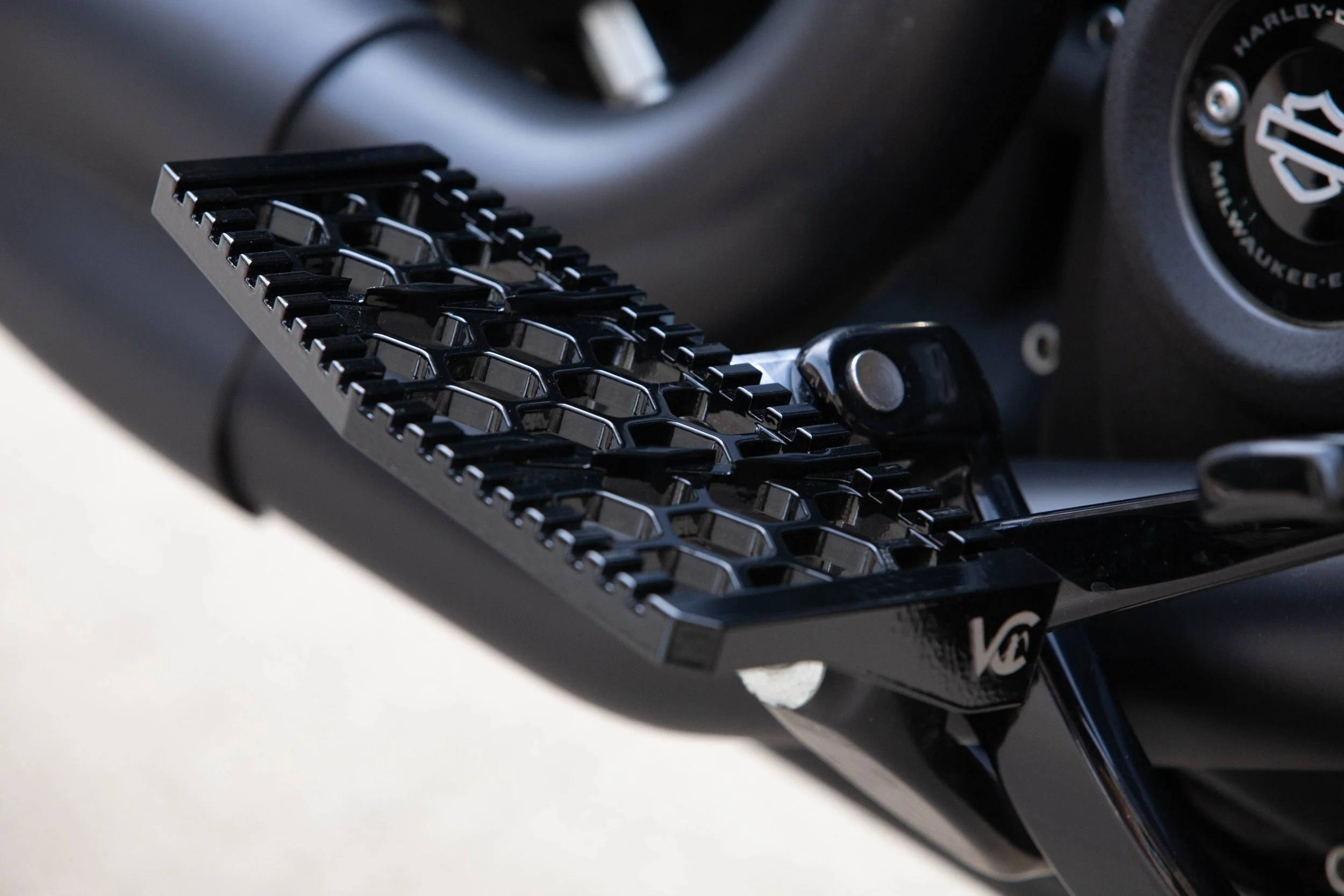 Vengeance Customs rider floorboards for 2018+ Harley-Davidson Softail in Black Eclipse, installed on motorcycle