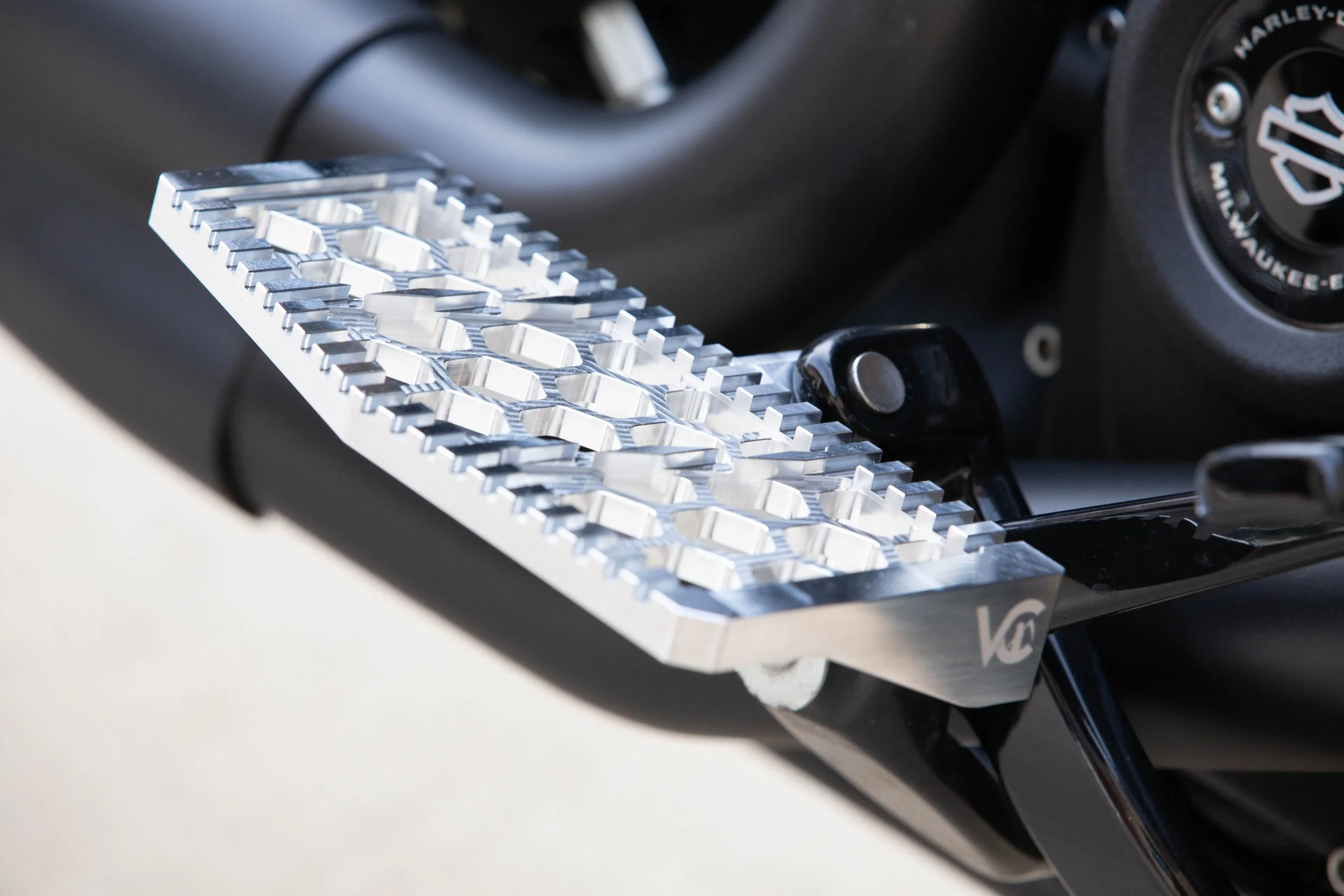 Vengeance Customs rider floorboards for 2018+ Harley-Davidson Softail in Raw Finish, installed on motorcycle