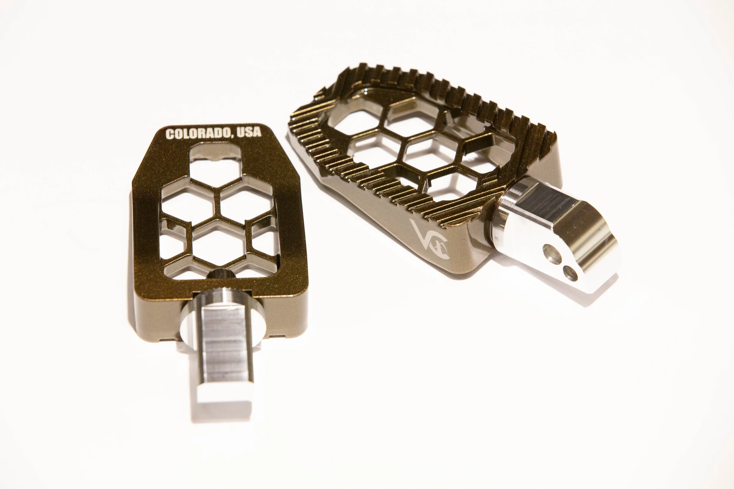 Vengeance Customs passenger footpegs for 2018+ Harley-Davidson Softail in Bronze Bound Finish, installed on motorcycle