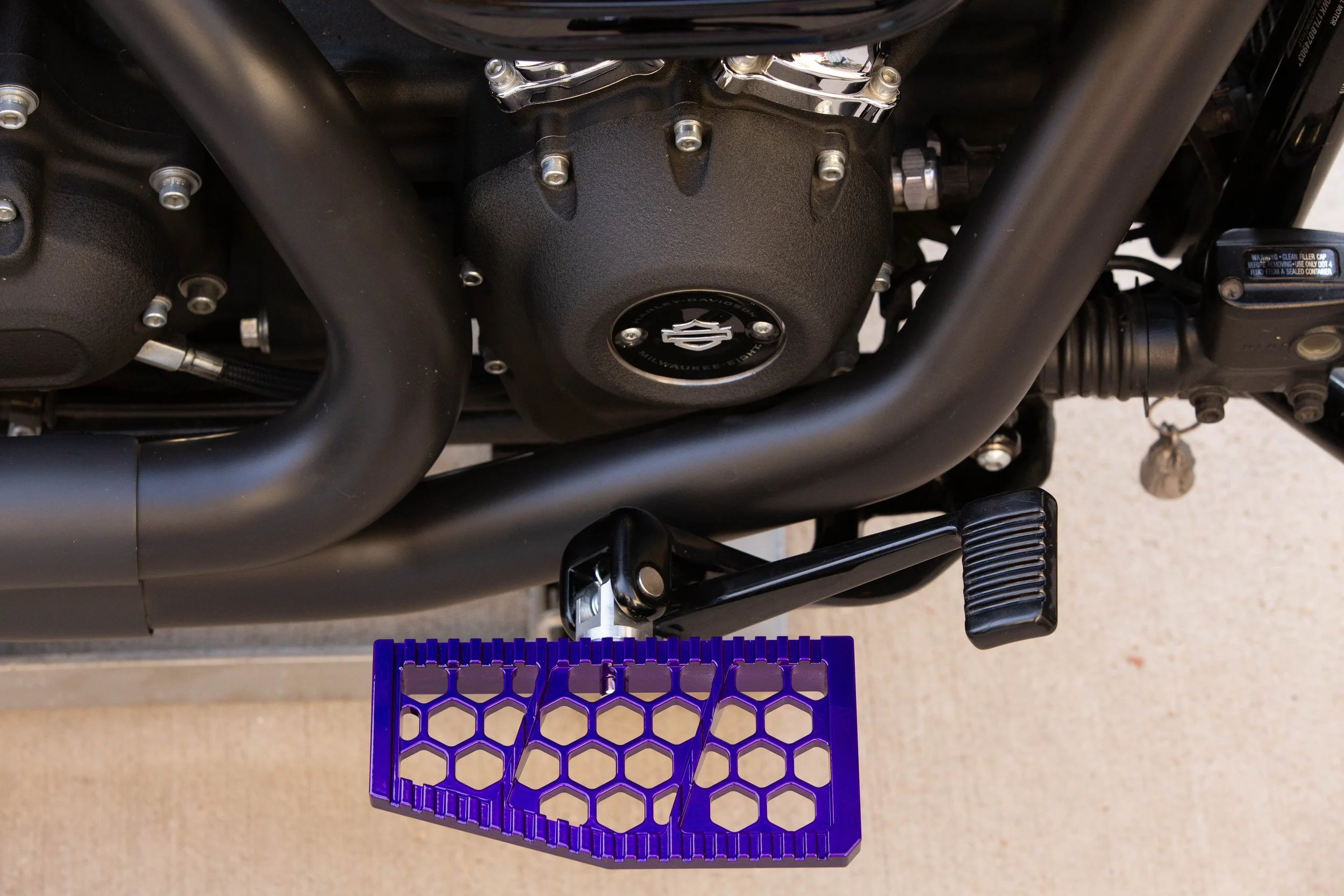 Vengeance Customs rider floorboards for 2018+ Harley-Davidson Softail in Purple Oblivion Finish, installed on motorcycle