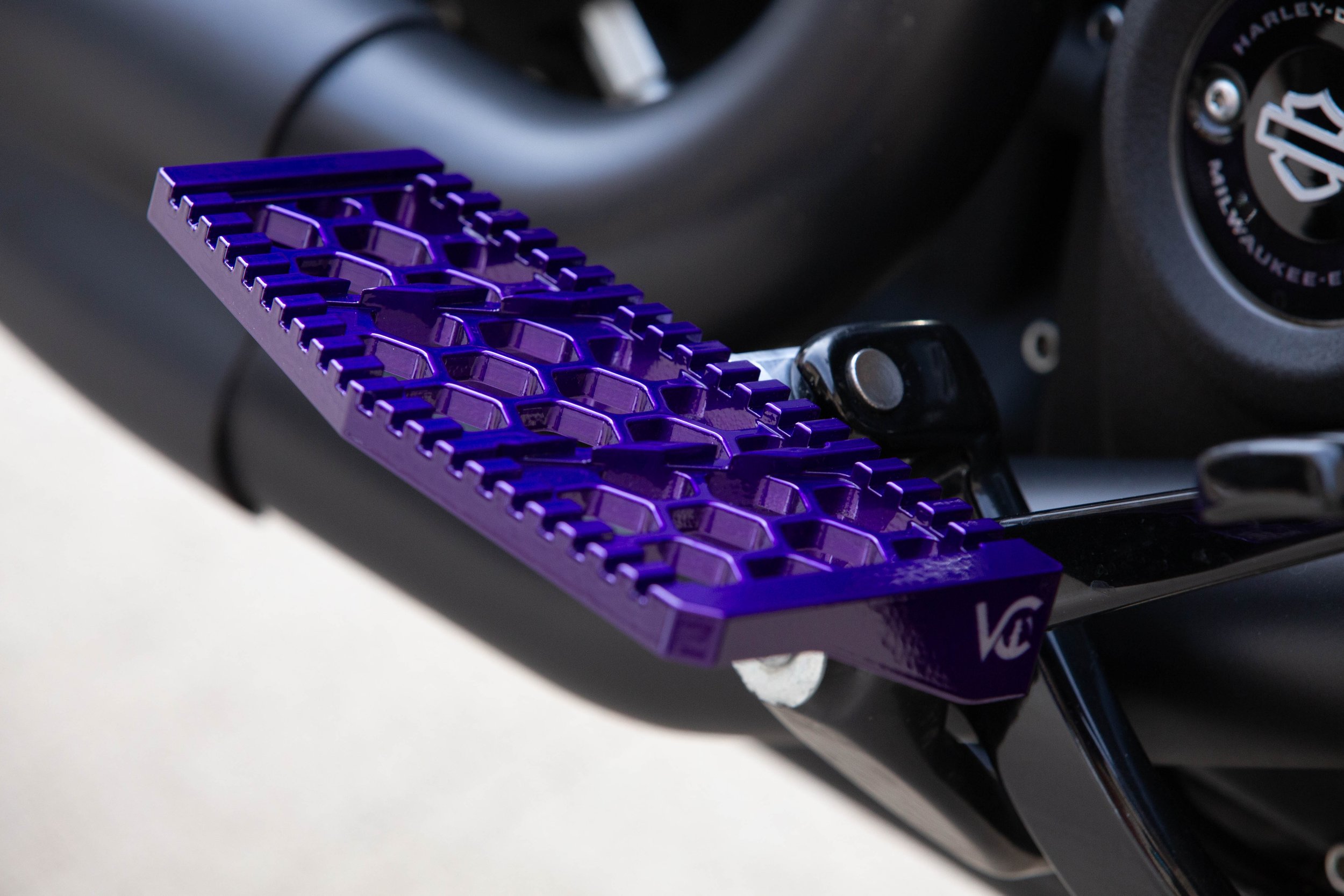 Vengeance Customs rider floorboards for 2018+ Harley-Davidson Softail in Purple Oblivion Finish, installed on motorcycle