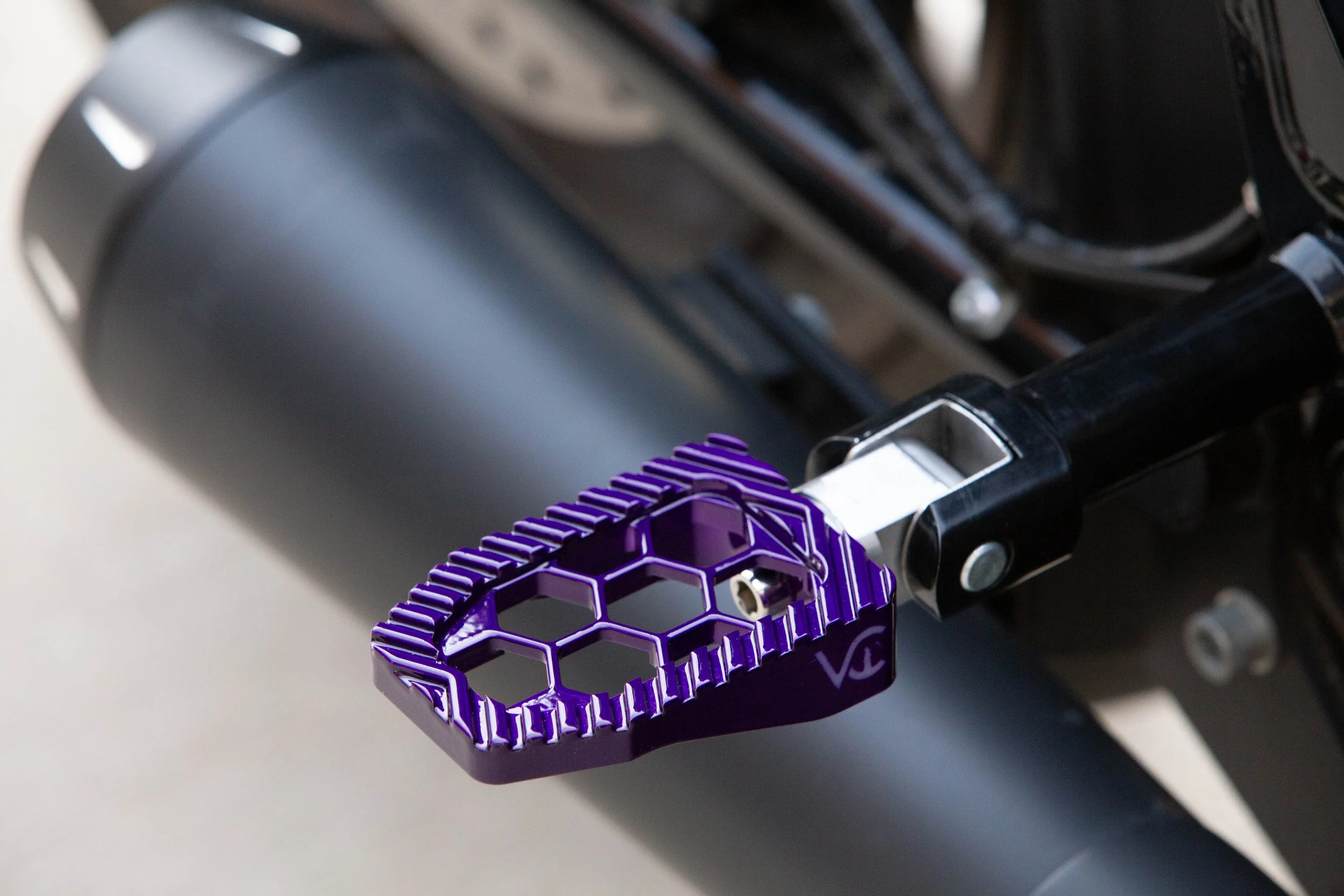 Vengeance Customs passenger footpegs for 2018+ Harley-Davidson Softail in Purple Oblivion Finish, installed on motorcycle