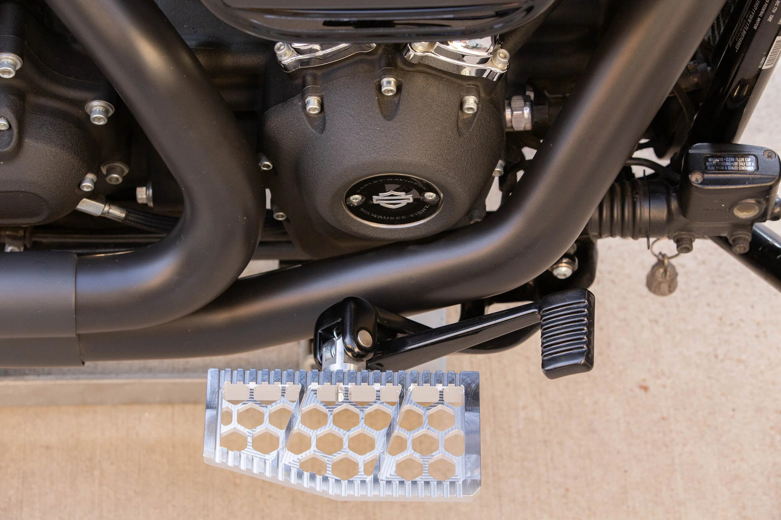 Vengeance Customs rider floorboards for 2018+ Harley-Davidson Softail in Raw Finish, installed on motorcycle