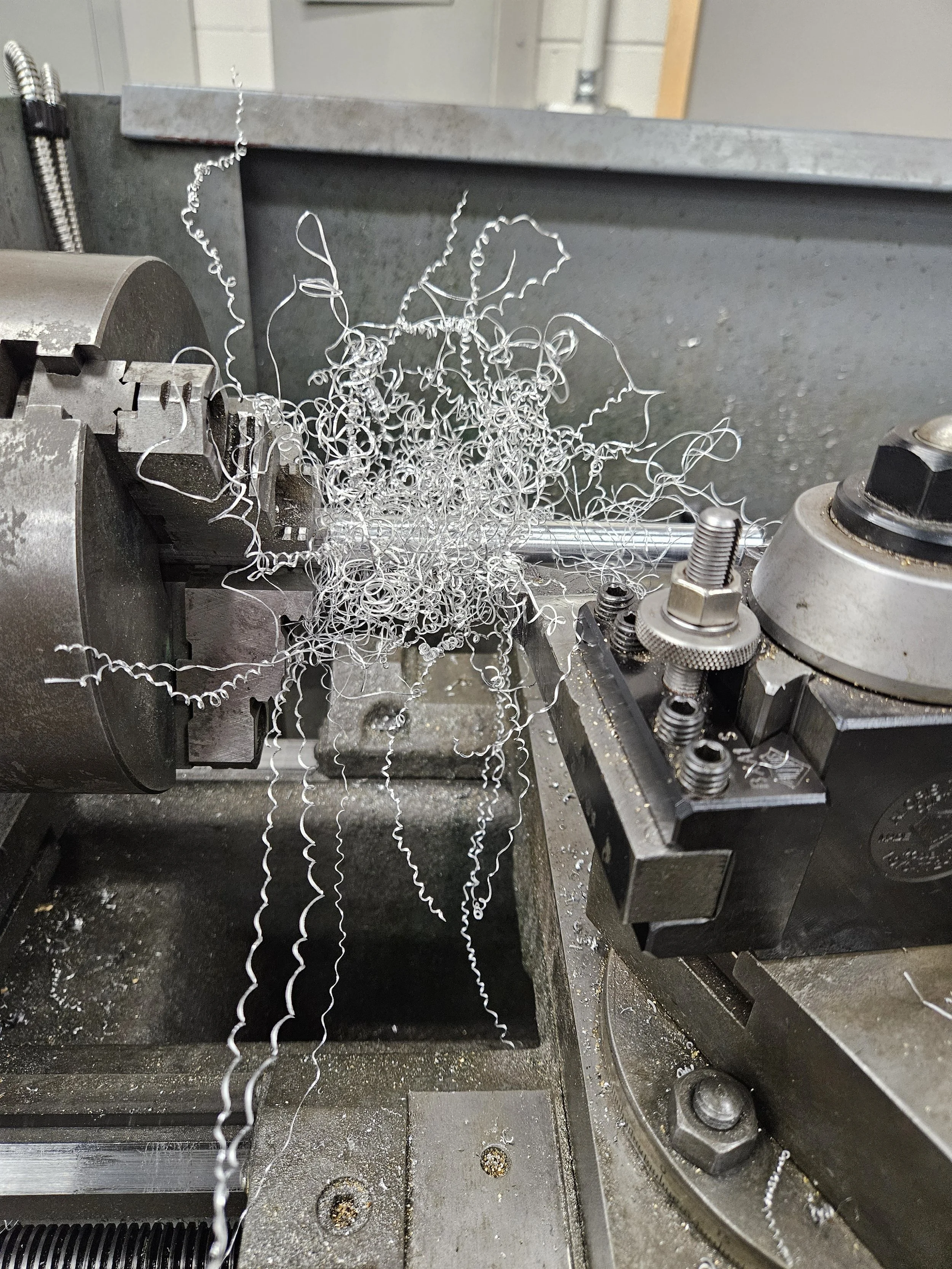 Lathe tangled with aluminum shavings