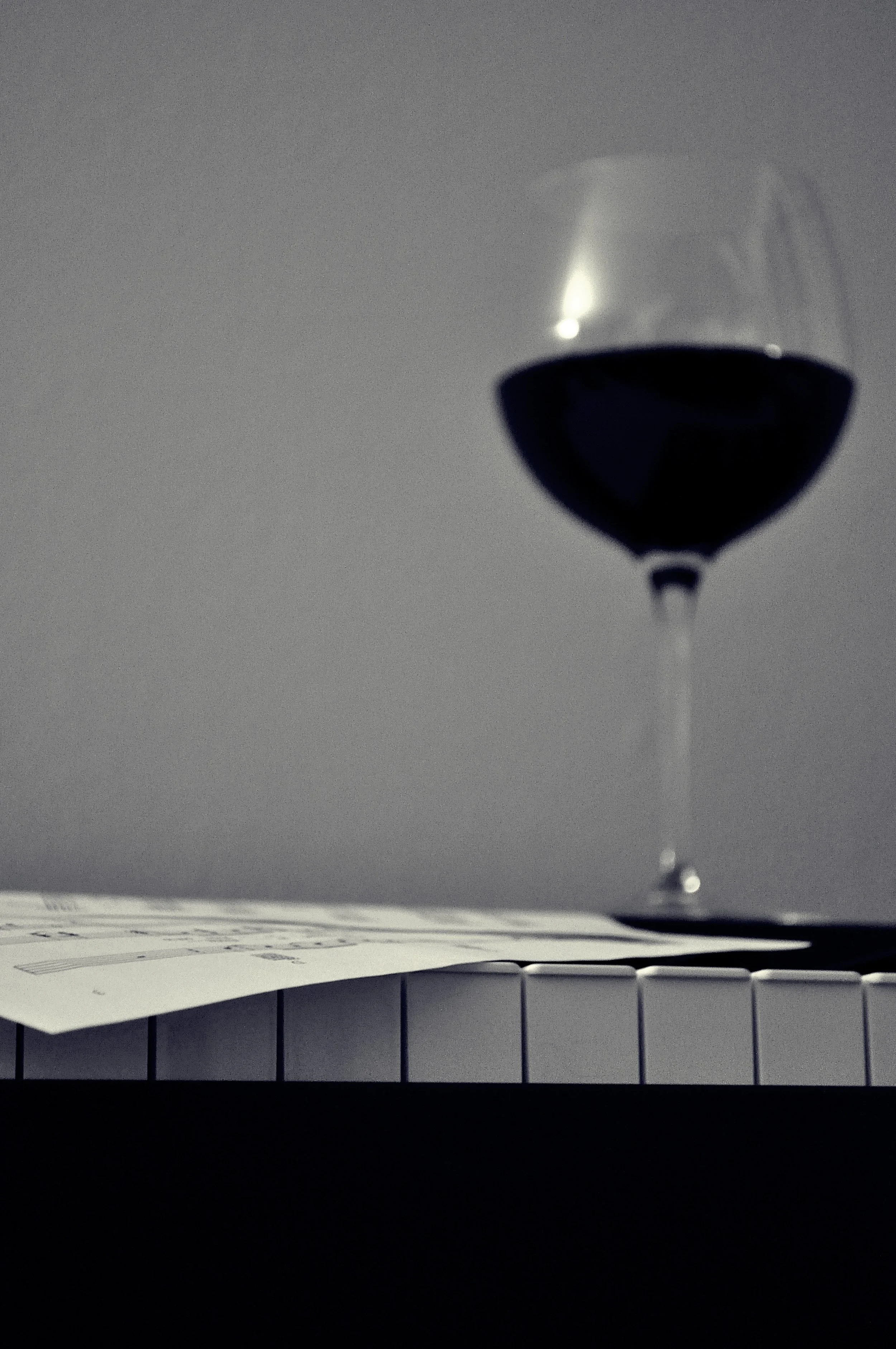 Drinking wine and playing the piano