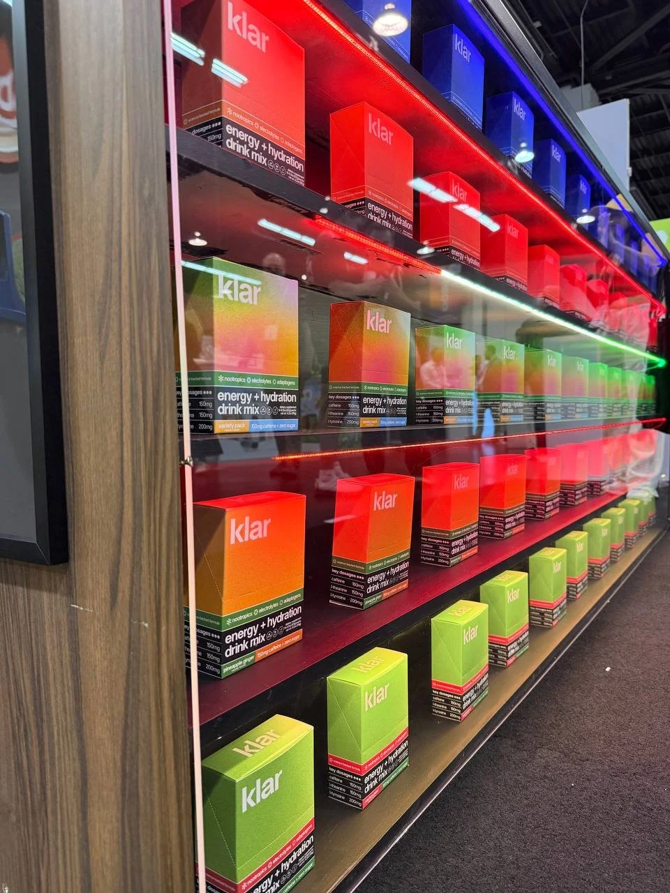 Shelves displaying boxes of Klar energy and hydration drink mix in a store.
