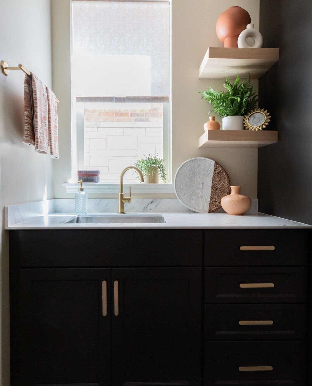 We all love before and after pics, right? Turning a disorganized space off the clients' garage into a customized, fully functional mudroom was a total joy project to complete. There are plenty of cabinet doors to hide all the stuff, a convenient sink