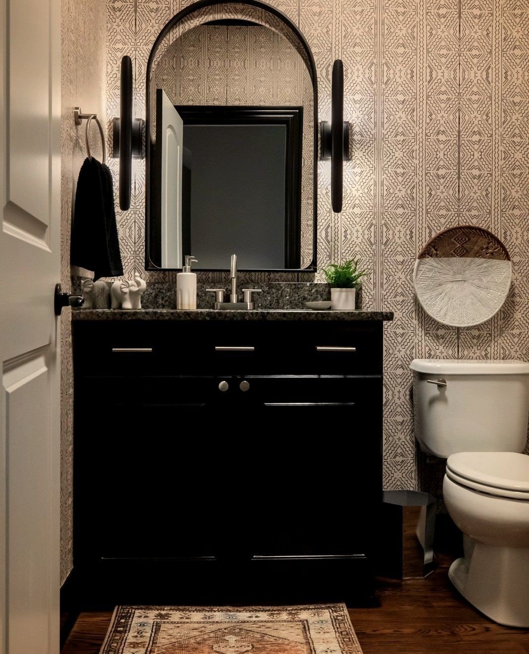 Prior to this powder room refresh, the bathroom was just ho-hum. Familiar with the builder grade look? Light fixture above a frameless mirror - all from Home Depot- this is what I had to work with and there was no where to go but up. ⁠
⁠
I loved gett
