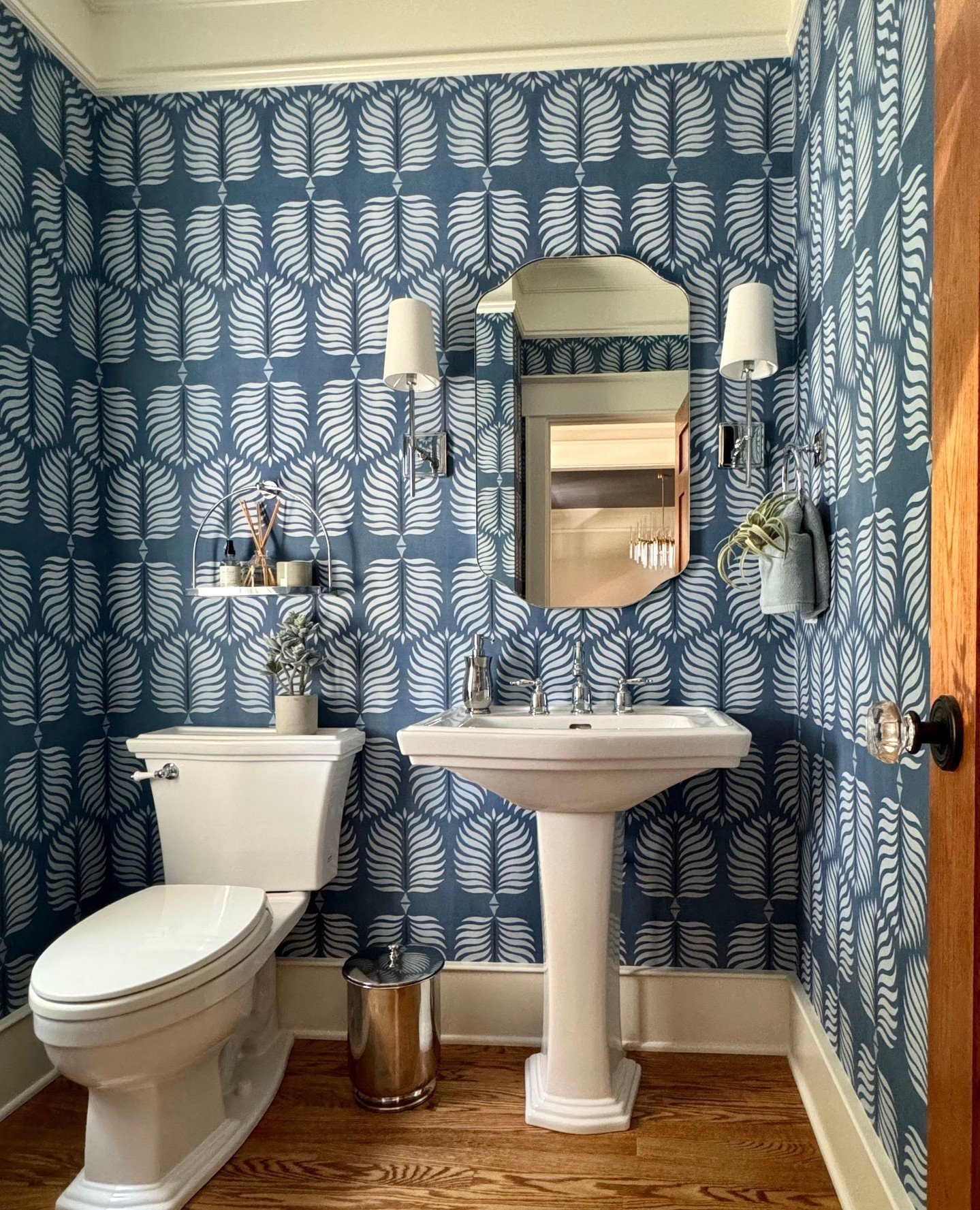 The Powder Room Reveal is Here! Our clients' built their craftsmen-style home 16 years ago and they hired us for the update. We enjoyed bringing fresh shades of blue, patterns and updated lighting to their beautiful custom built home.⁠ Isn't this a s