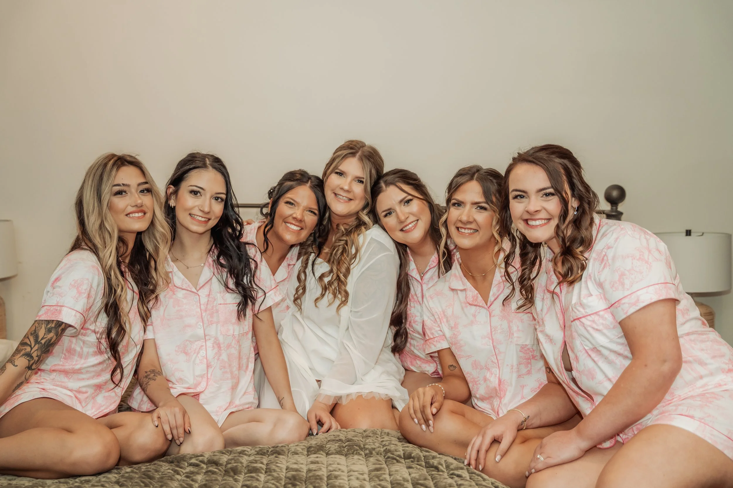 Bride and bridesmaids in matching PJs while getting ready