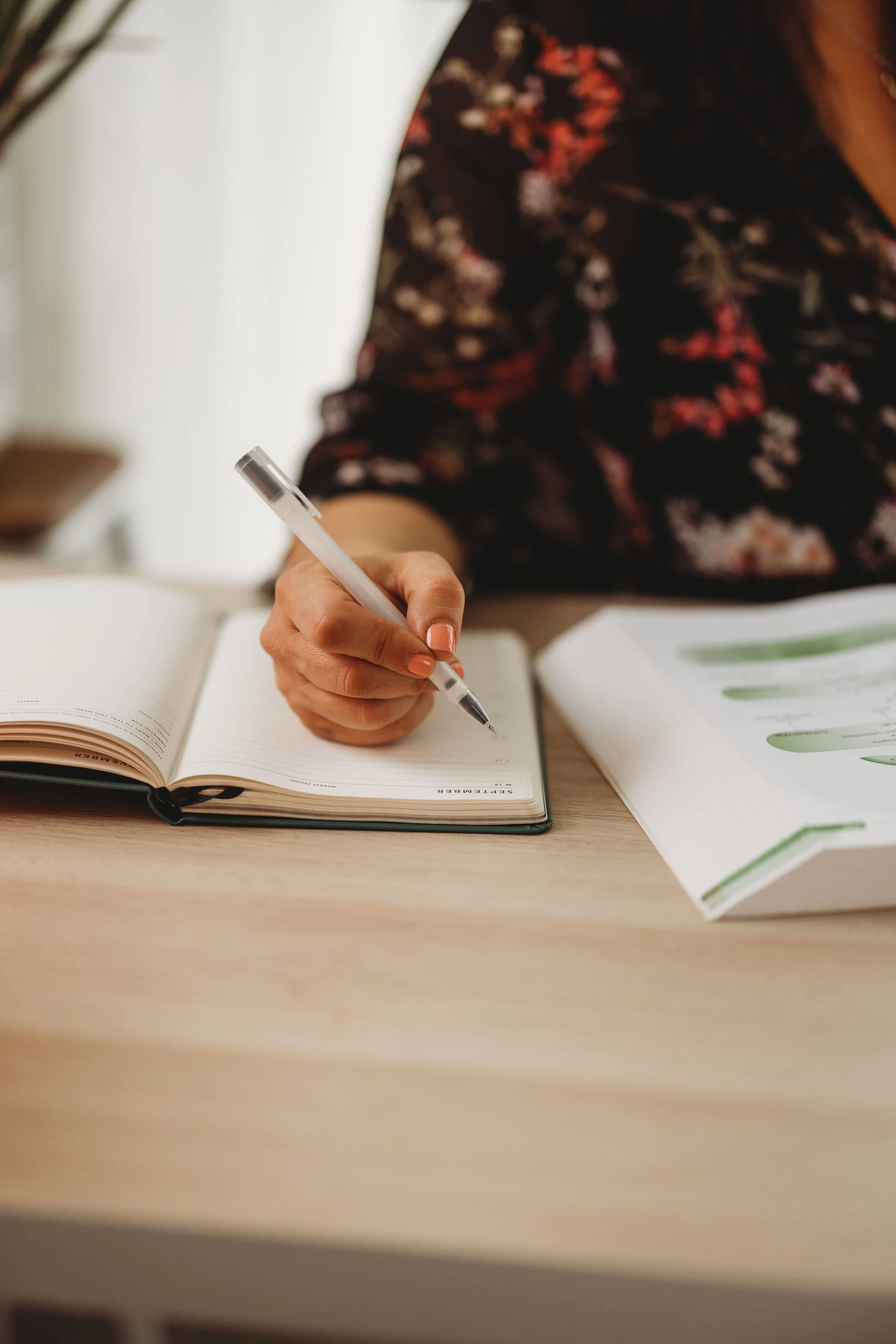 Naturopath writing notes during a Hashimoto's consultation at Wholme Naturopathy