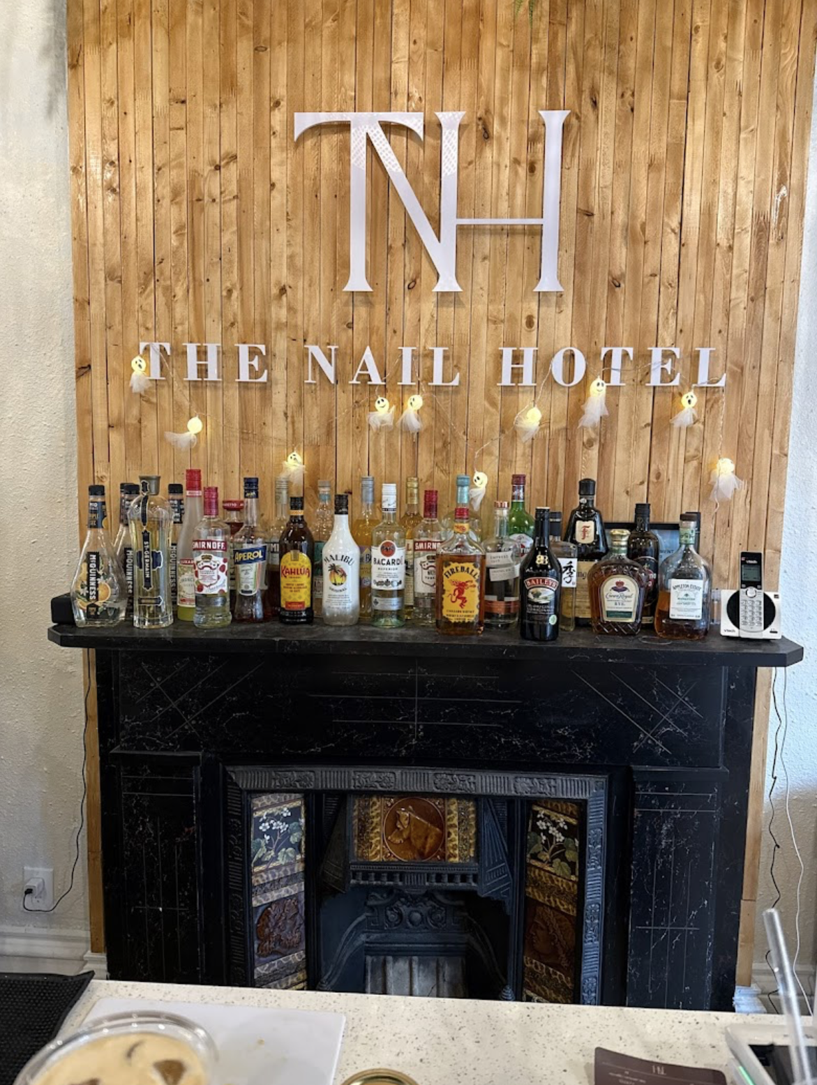 Interior architectural detail in Hess Village nail salon highlighting feature wall and material palette