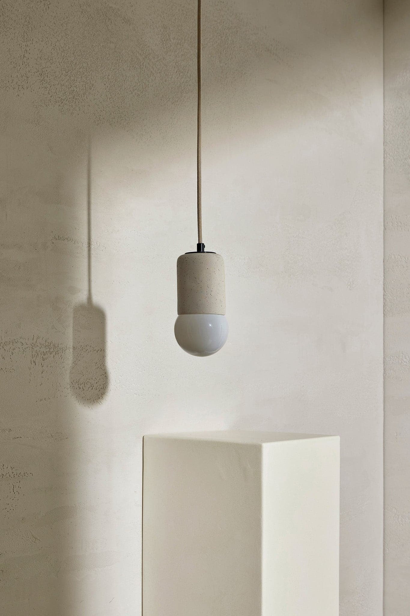 MarzDesigns_Terra1Pendant_VanillaBean_BrushedBlack_Opal_FabricFlex_Fronton_off_Crop.jpeg