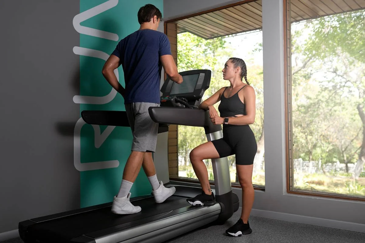 Running physical therapy session with treadmill gait analysis to improve performance and reduce injury risk.