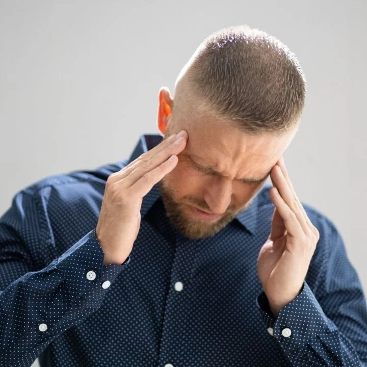 Man experiencing dizziness and balance symptoms related to a vestibular disorder.
