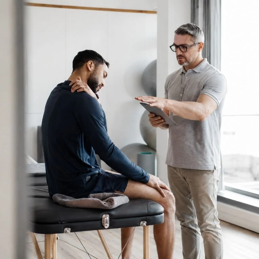 Physical therapist assessing patient with chronic neck pain and headaches.
